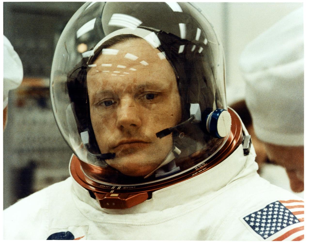 KENNEDY SPACE CENTER, FLA. - Technicians make the final adjustments to Apollo 11 Commander Neil A. Armstrong's spacesuit as he prepares to take part in a space vehicle Countdown Demonstration Test (CDDT). Astronauts Armstrong, Aldrin and Collins are practicing for ther mission, the first manned Lunar landing.