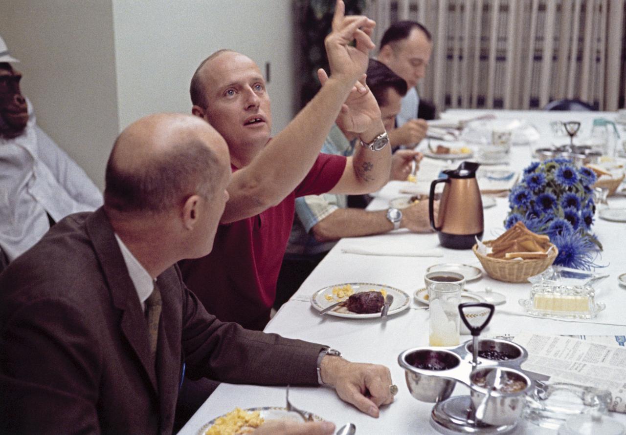 CAPE CANAVERAL, Fla. - Apollo 12 commander Charles "Pete" Conrad, in red shirt, talks during the breakfast on launch day Nov. 14, 1969.    Photo credit: NASA