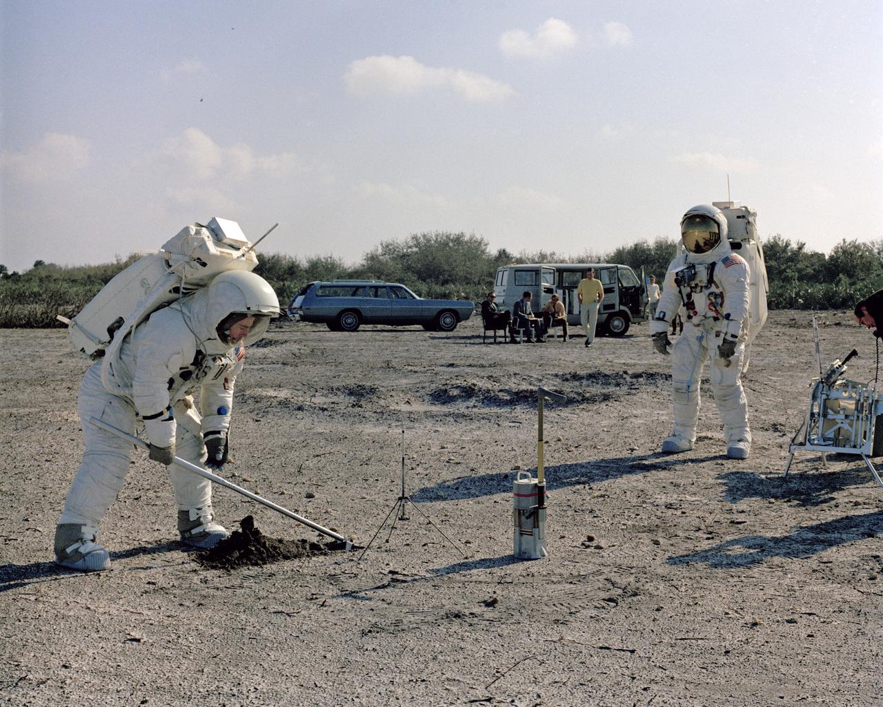 CAPE CANAVERAL, Fla. -- Backup Commander John Young, left, and Lunar Module Pilot Charlie Duke are going through a practice exercise for the Apollo 13 mission at a field site at the Kennedy Space Center. Photo credit: NASA