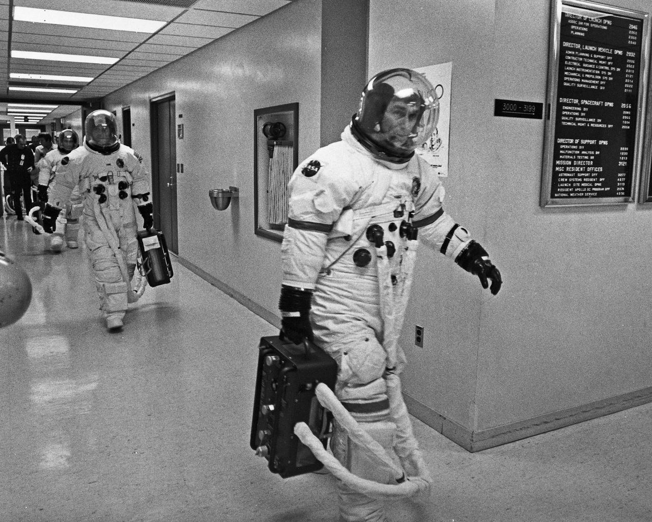 Apollo 17 prime crewman Eugene A. Cernan, Commander, Ronald E. Evans, Command Module Pilot, and Harrison H. Schmitt, Lunar Module Pilot, from right, leave the MSOB to participate in a final dress rehearsal for the Launch of Apollo 17 December 6 at 9:53 P.M. EST.