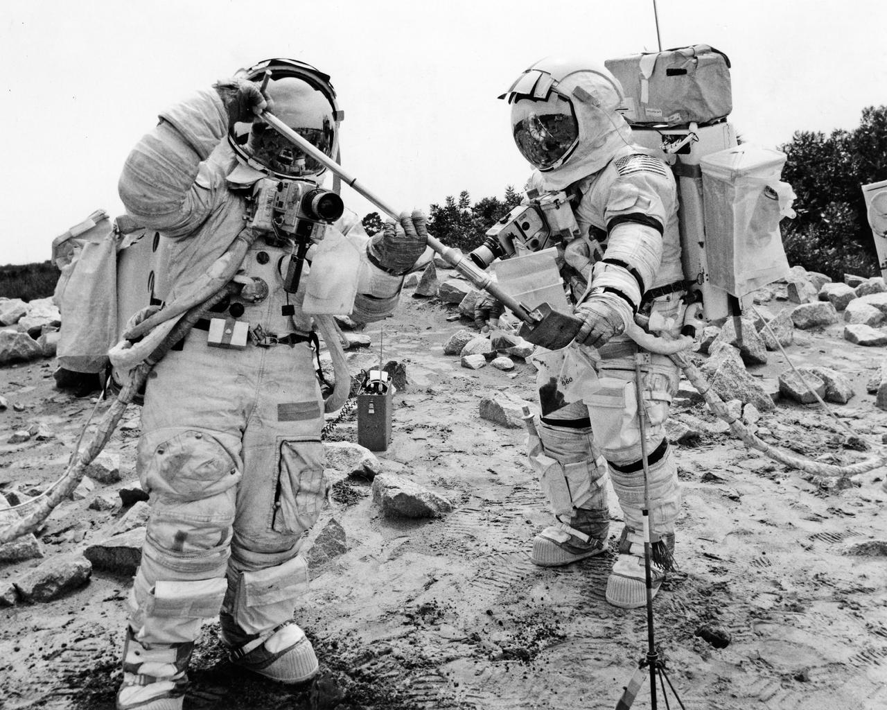 CAPE CANAVERAL, Fla. -- Apollo 17 Lunar Module Pilot Harrison H. Schmitt, left, scoops soil samples into a specimen bag held by Mission Commander Eugene A. Cernan during a mock lunar surface training exercise conducted at the Kennedy Space Center.  Schmitt and Cernan are scheduled to remain on the lunar surface 75 hours, leaving their lunar module spacecraft three times to explore the Moon’s Taurus-Littrow region.  Launch of the Apollo Saturn V spacecraft vehicle, also with Astronaut Command Module Pilot Ronald E. Evans onboard, is scheduled no earlier than December 6, 1972.  Photo credit: NASA