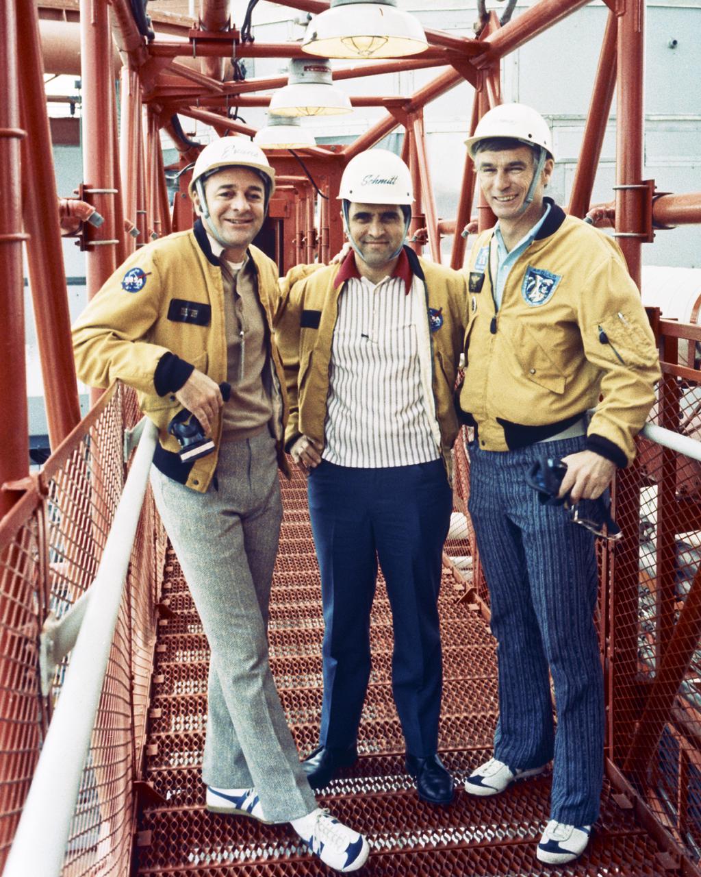 The Apollo 17 prime astronaut crew observes pre-launch activity at Complex 39A while participating in Emergency Egress Test. They are, left to right, Ronald E. Evans, Harrison H. Schmitt, and Eugene A. Cernan.
