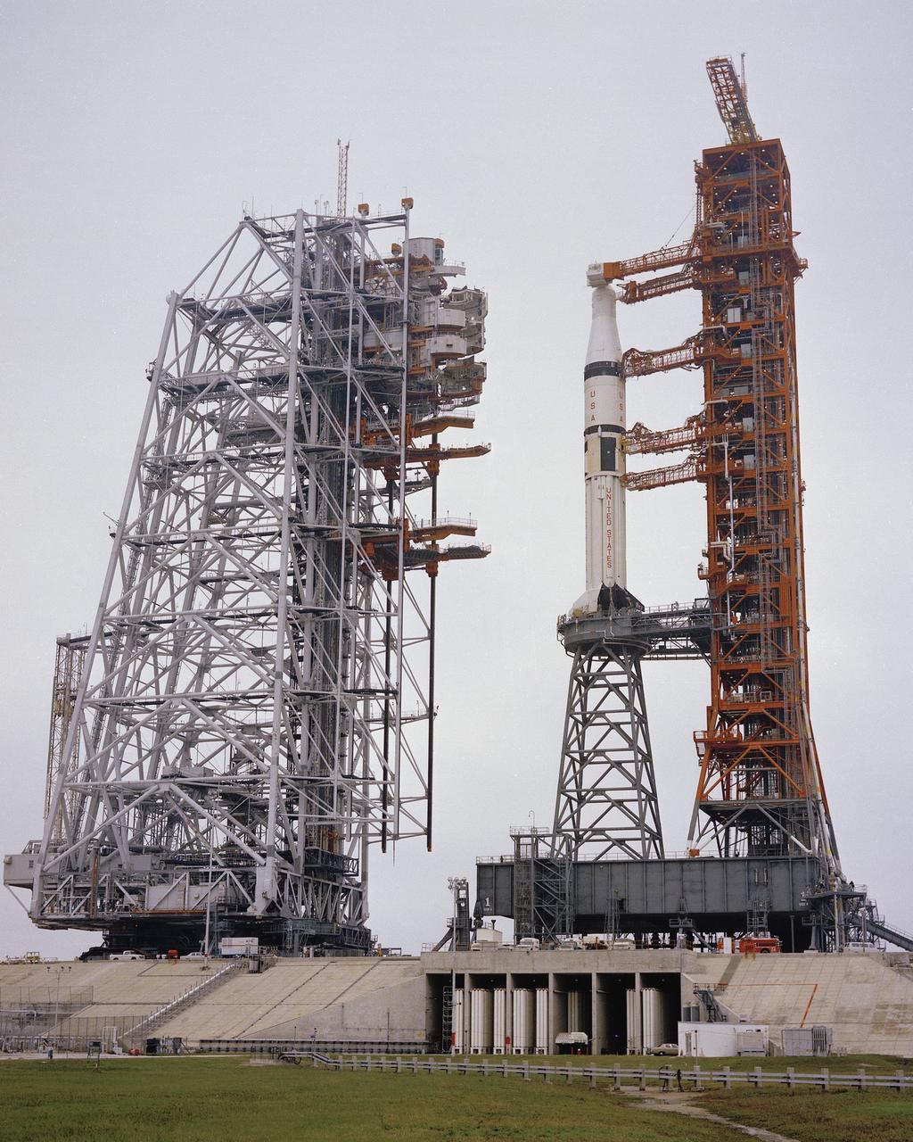 CAPE KENNEDY, Fla. -- At the Kennedy Space Center in Florida, the mobile service structure moves from its park site into position at Launch Complex 39B and surround the Skylab 2 rocket. Photo Credit: NASA