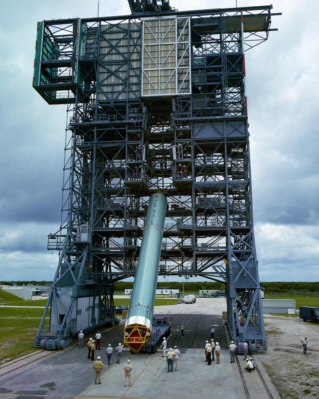 Erection of 1st Stage of Delta Vehicle for SYMPHONIE-B Mission. Complex 17A, CCAFS, June 30, 1975.