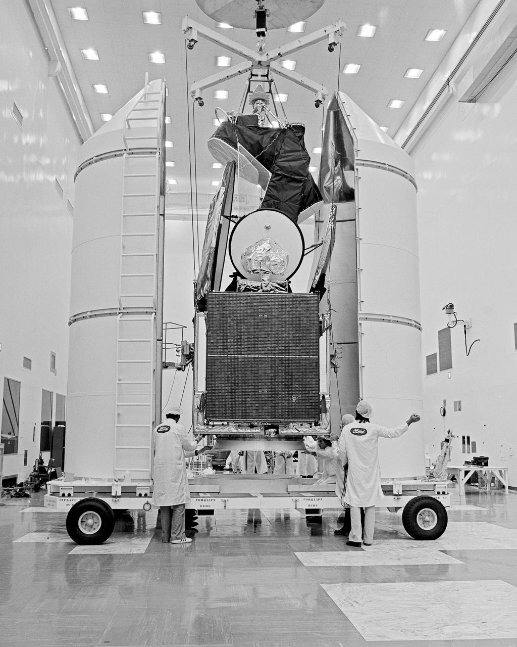 CAPE CANAVERAL, Fla. -- At Cape Canaveral Air Force Station in Florida, the INTELSAT V spacecraft is enclosed in a protective shroud for transport from Hangar AO to the Explosive Safe Facility for final servicing and encapsulation.  This is the first of a new series of INTELSAT spacecraft. The INTELSAT V is the largest and highest-capacity commercial communications satellite built to date. The 4,300-pound spacecraft is scheduled for launch on an Atlas Centaur rocket from Complex 36 no earlier than December 4. It will operate in geosynchronous orbit over the Atlantic Ocean. Photo Credit: NASA