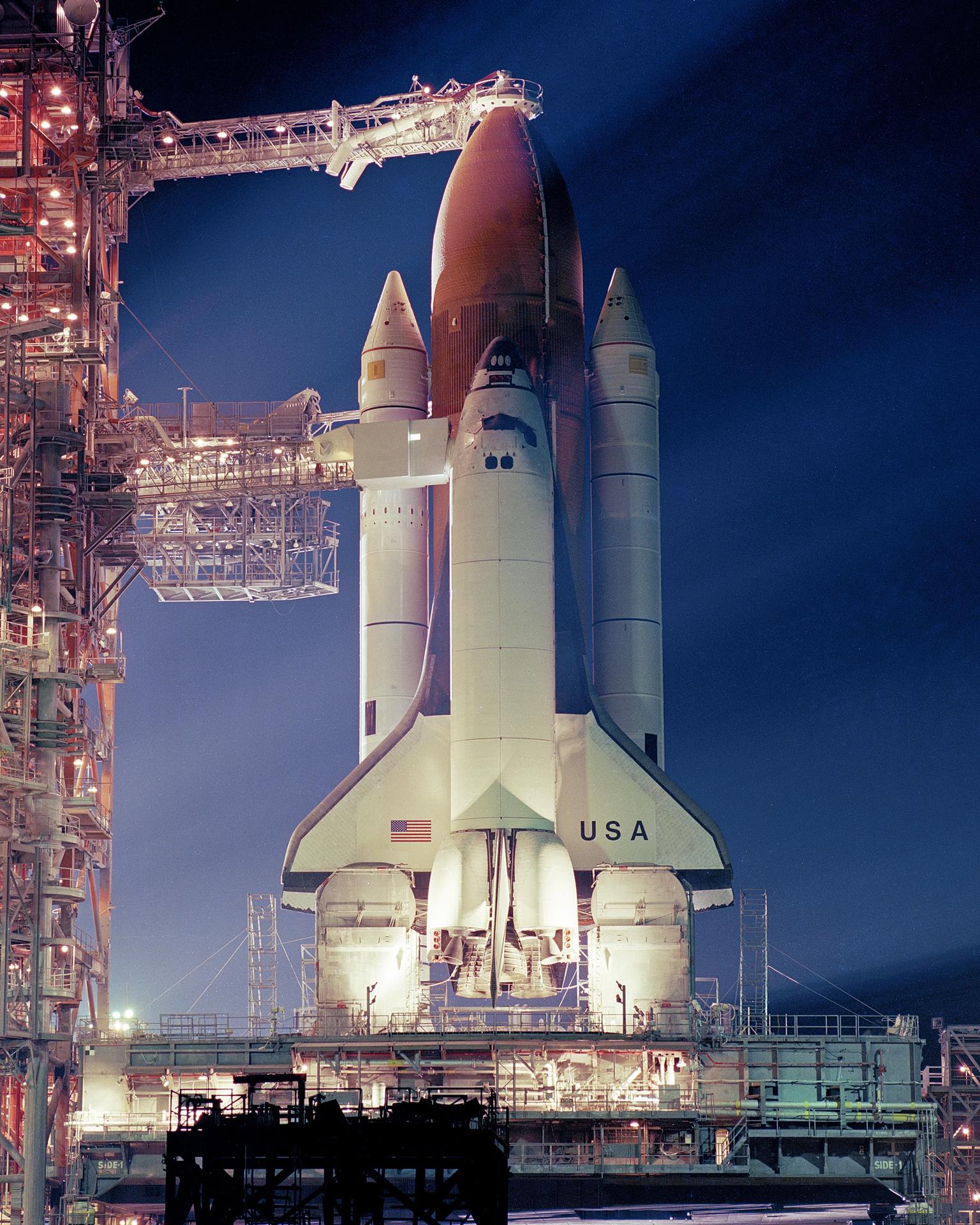 Illuminated by floodlights, Space Shuttle Columbia waits on Launch Pad 39A prior to launch on the evening of February 25, 1982.