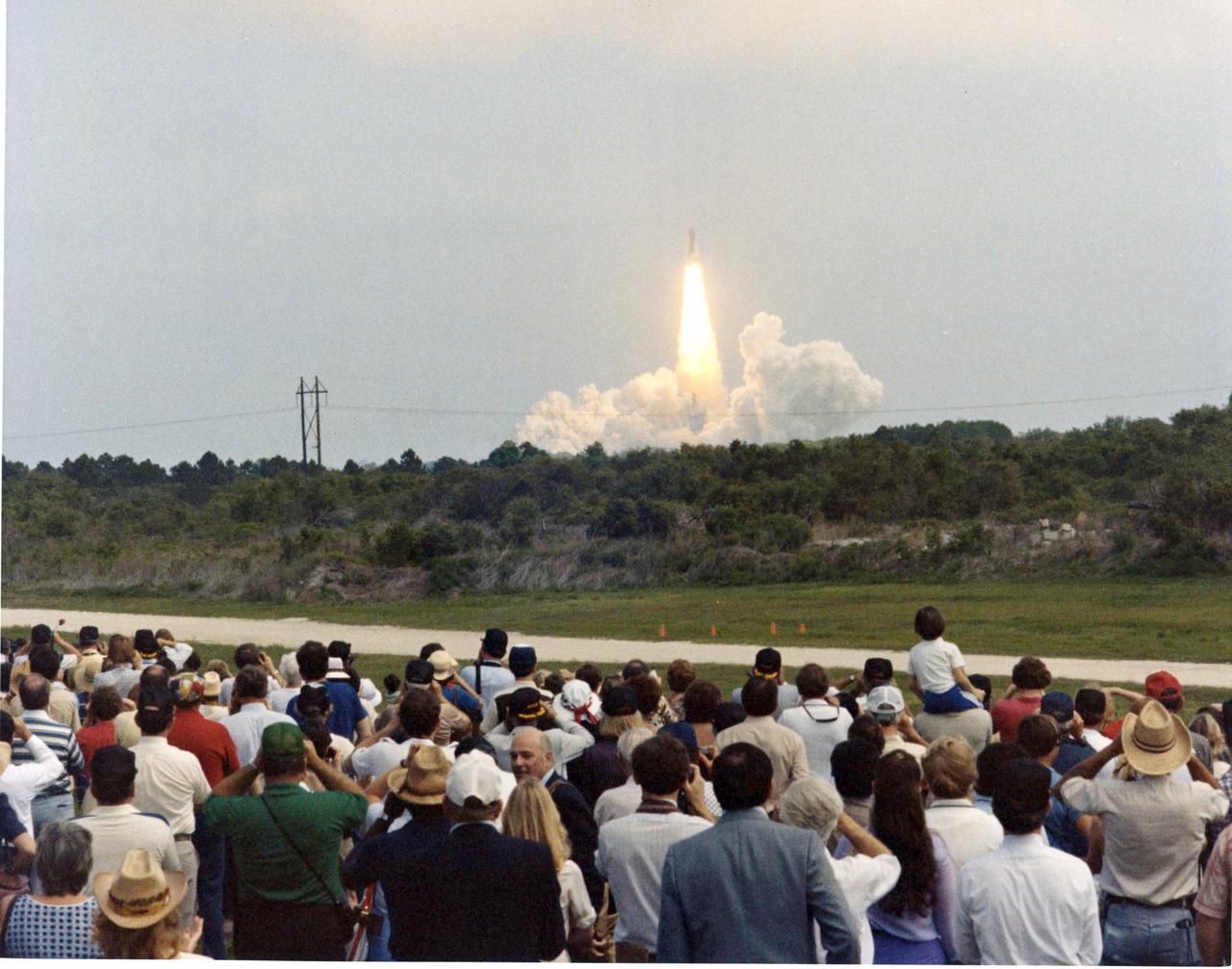 Columbia is cheered on its way by distinguished guests viewing the launch from the Schwartz Road VIP site, located about five miles from the launch pad. About 4,500 invited visitors at the site watched the 11 a.m. liftoff of Columbia on its third orbital flight. 