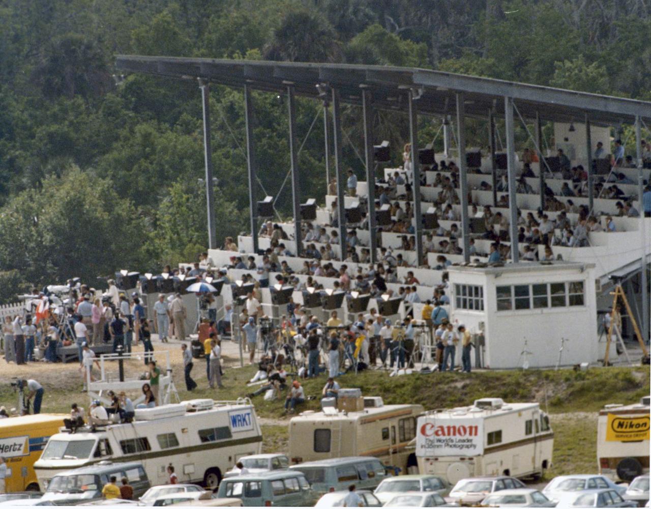 The Complex 39 press site buzzes with activity during the final countdown to the launch of the third space shuttle flight. More than 2,000 news media representatives from around the world crowded onto the press site this morning to watch the successful 11 a.m. launch.
