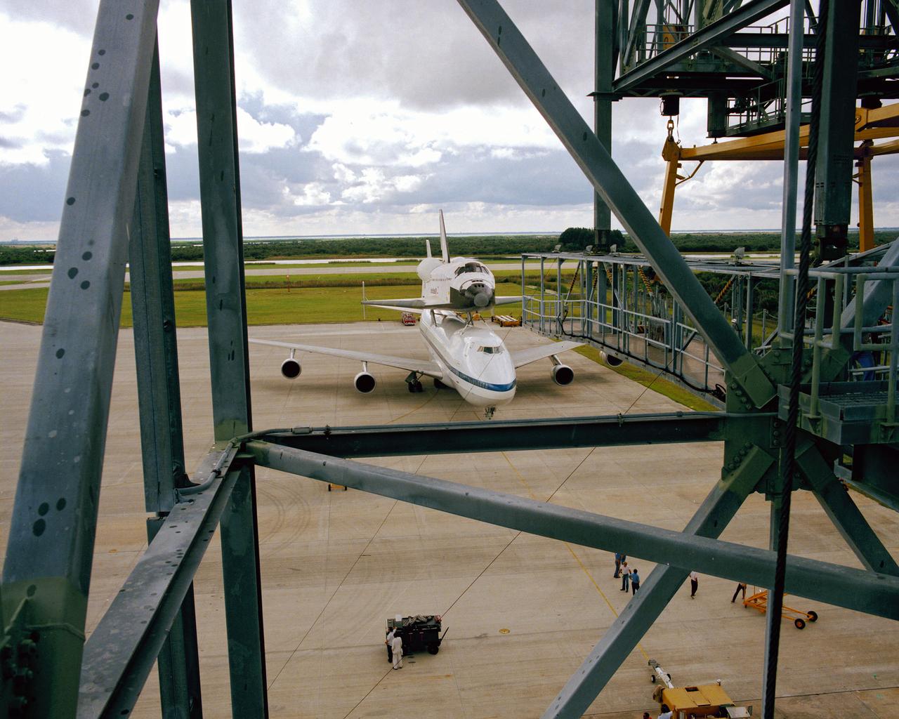 NASA's newest bird, the space shuttle orbiter Discovery, is perched on the 747/shuttle carrier aircraft awaiting positioning at the Mate-Demate Facility at Kennedy Space Center.
