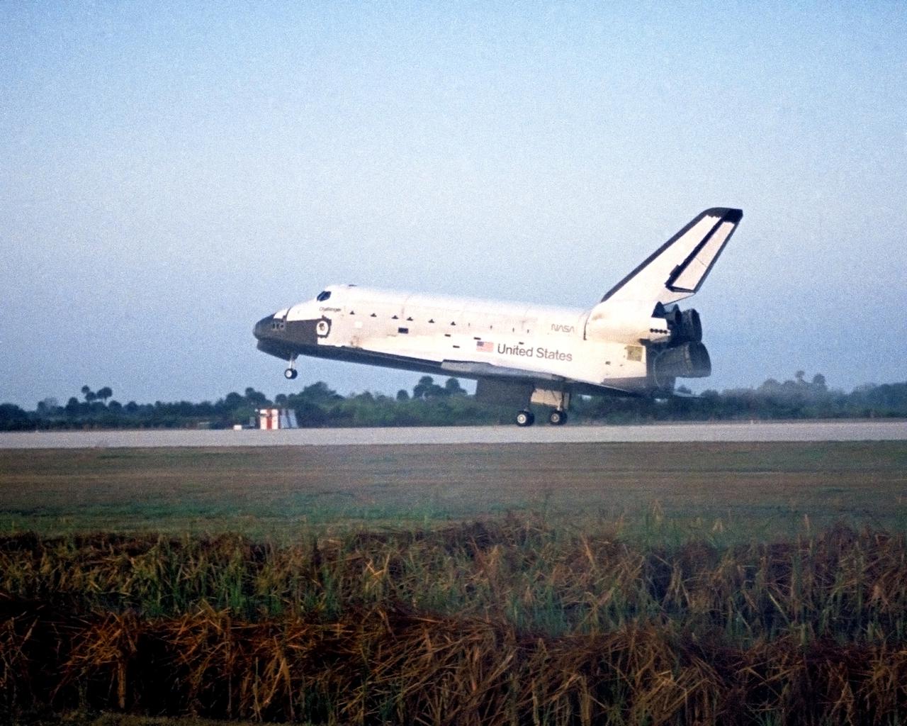 CAPE CANAVERAL, Fla. -- Commander Vance Brand and Pilot Robert 'Hoot' Gibson guide the space shuttle orbiter Challenger to the first-ever landing of a returning spaceship at Kennedy Space Center.  The historic touchdown occurred at 7:15:55 a.m. EST Feb. 11, 1984 -- about five miles from Launch Pad 39A where the 41B mission began eight days earlier. Also aboard the tenth space shuttle flight were Mission Specialists Bruce McCandless II, Ronald McNair and Robert Stewart.  Photo credit: NASA