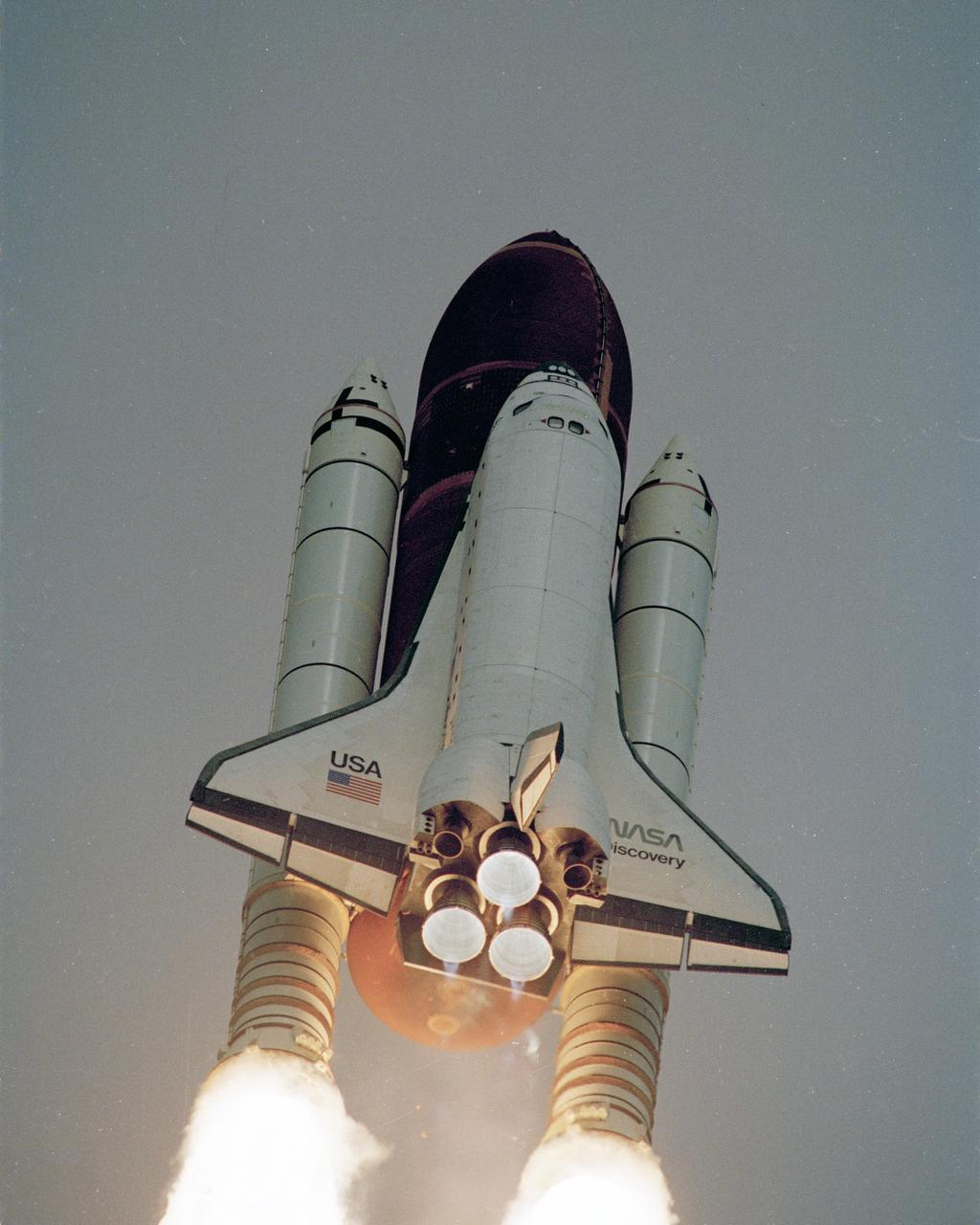 The space shuttle Discovery lifts off from Launch Pad 39-B at 8:33 a.m. EDT carrying a crew of five and the Hubble Space Telescope. STS-31 crew members are Commander Loren Shriver, Pilot Charles Bolden and Mission Specialists Steven Hawley, Bruce McCandless II and Kathryn Sullivan. Photo credit: NASA