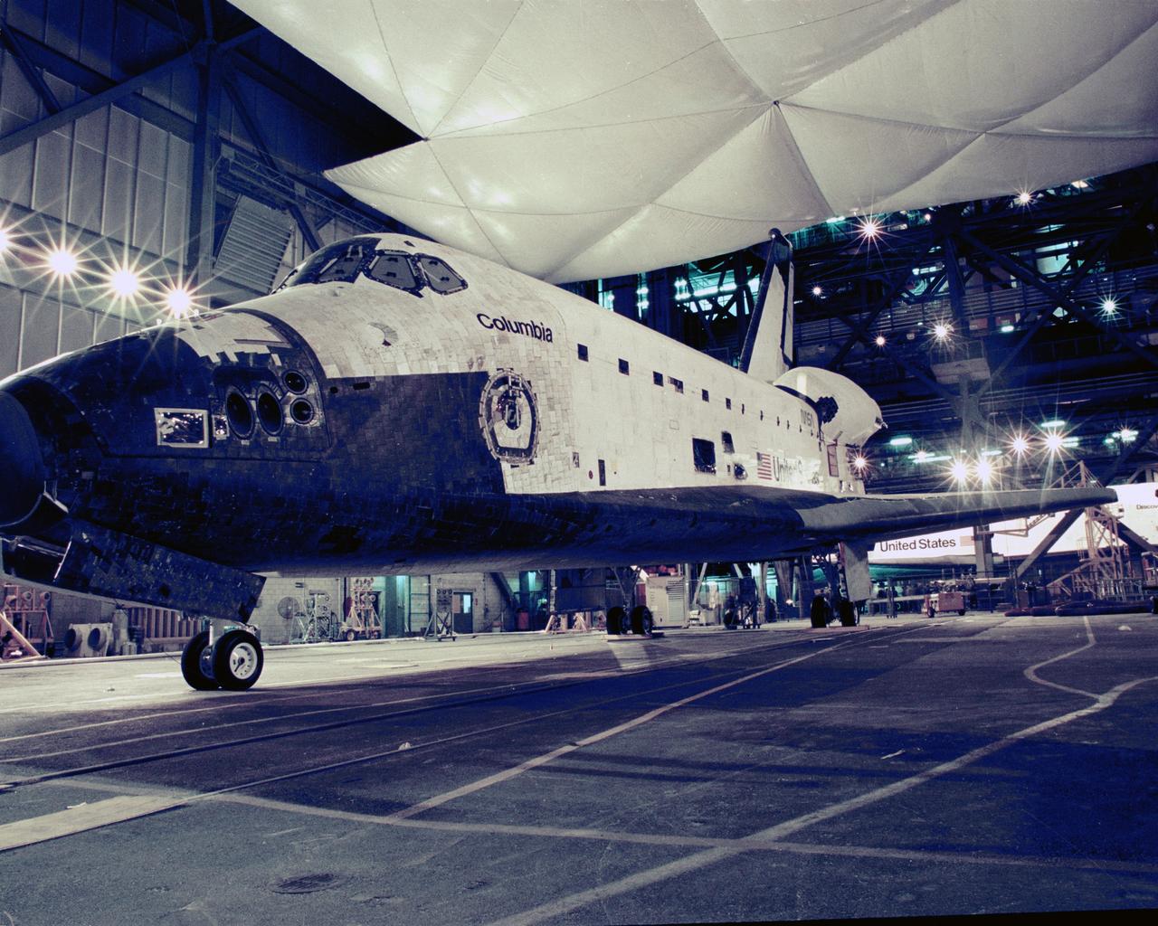 CAPE CANAVERAL, Fla. – Two space planes pass inside the VAB as the orbiter Discovery is towed past its sister ship, Columbia.    Photo credit: NASA