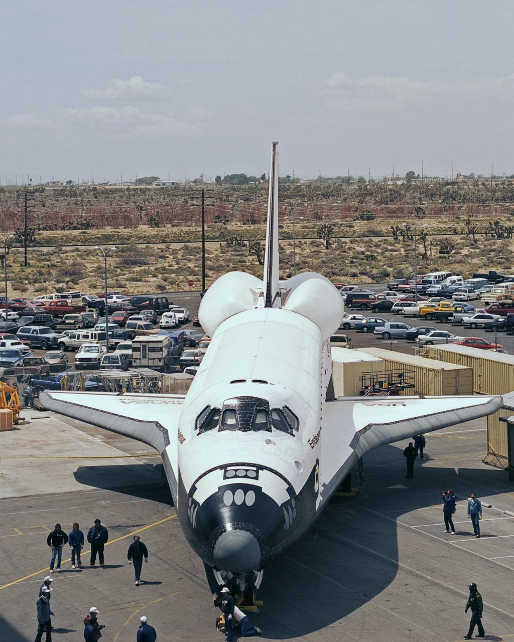 The newest space shuttle orbiter, Endeavour is ready to roll out of the hangar at Palmdale, Calif. OV-105 features many design enhancements, including drag chute for safer landings and equipment to allow the orbiter to remain in space for up to 28 days. Photo credit: NASA