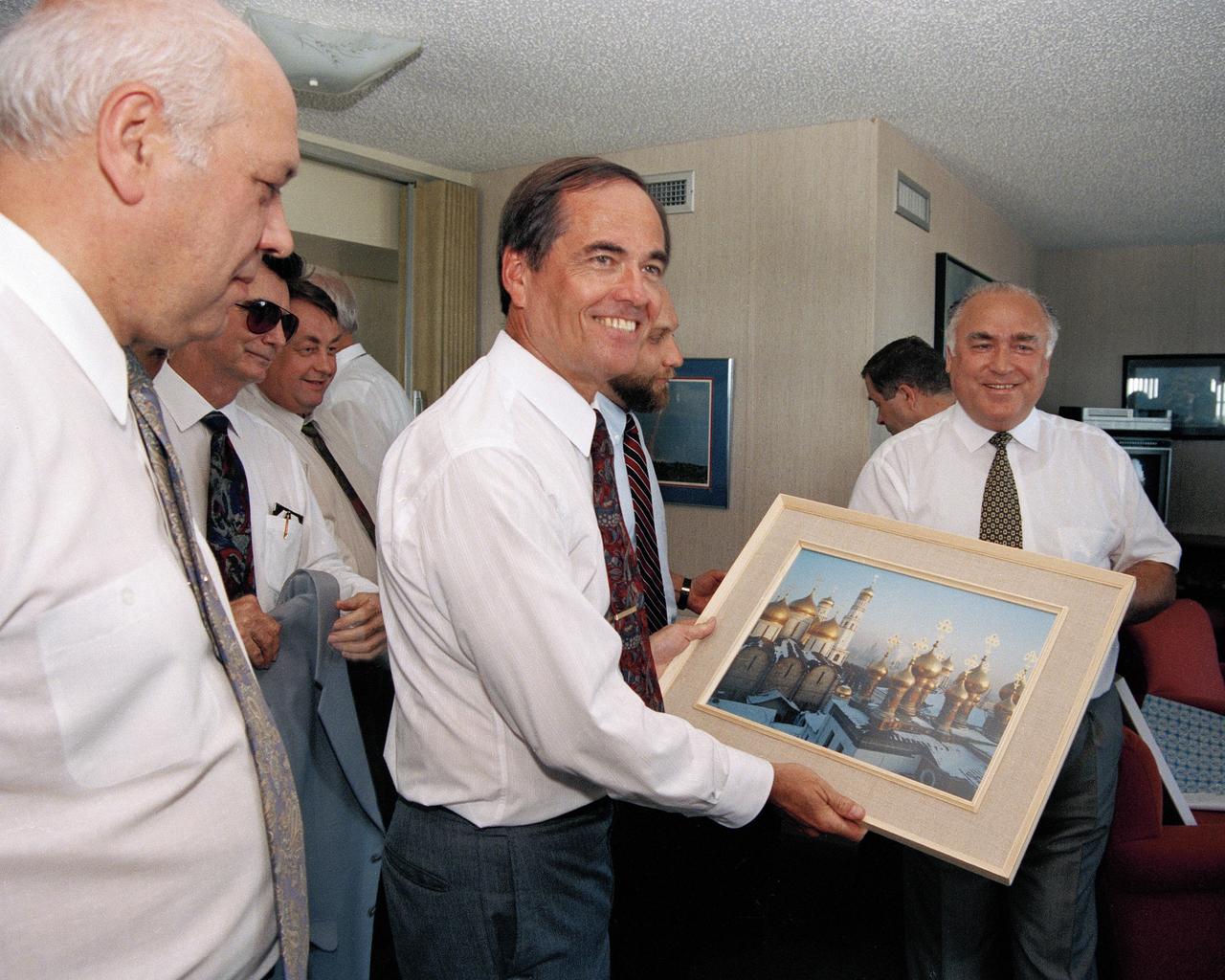 CAPE CANAVERAL, Fla. -- At the Kennedy Space Center in Florida, Russian Prime Minister Viktor Chernomyrdin, right, presents a framed photograph of the Kremlin to center director Robert Crippen during a visit to the space center. Space, energy and the environment are the three major focuses of the Russian's U.S. visit, which also included a stop at the agency's Johnson Space Center. Photo Credit: NASA