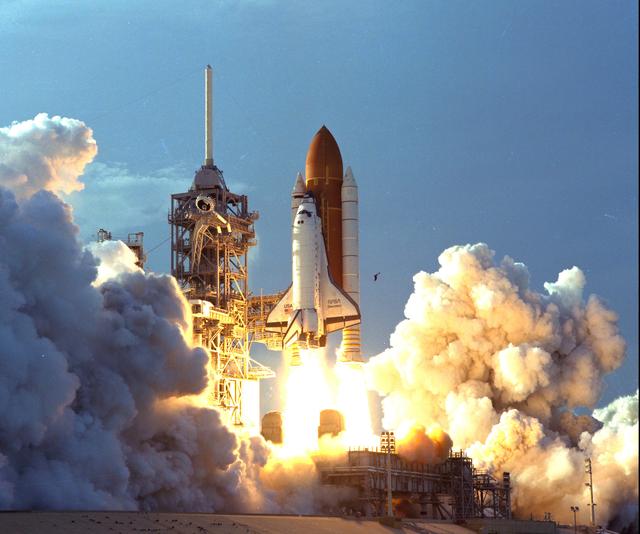 KENNEDY SPACE CENTER, FLA. - The turbulent weather common to a Florida afternoon in the summer subsides into a serene canopy of cornflower blue, and a manmade "bird" takes flight.  The Space Shuttle Discovery soars skyward from Launch Pad 39B on Mission STS-64 at 6:22:35 p.m. EDT, Sept. 9.  On board are a crew of six: Commander Richard N. Richards; Pilot L. Blaine Hammond Jr.; and Mission Specialists Mark C. Lee, Carl J. Meade, Susan J. Helms and Dr. J.M. Linenger.  Payloads for the flight include the Lidar In-Space Technology Experiment (LITE), the Shuttle Pointed Autonomous Research Tool for Astronomy-201 (SPARTAN-201) and the Robot Operated Material Processing System (ROMPS).  Mission Specialists Lee and Meade also are scheduled to perform an extravehicular activity during the 64th Shuttle mission.