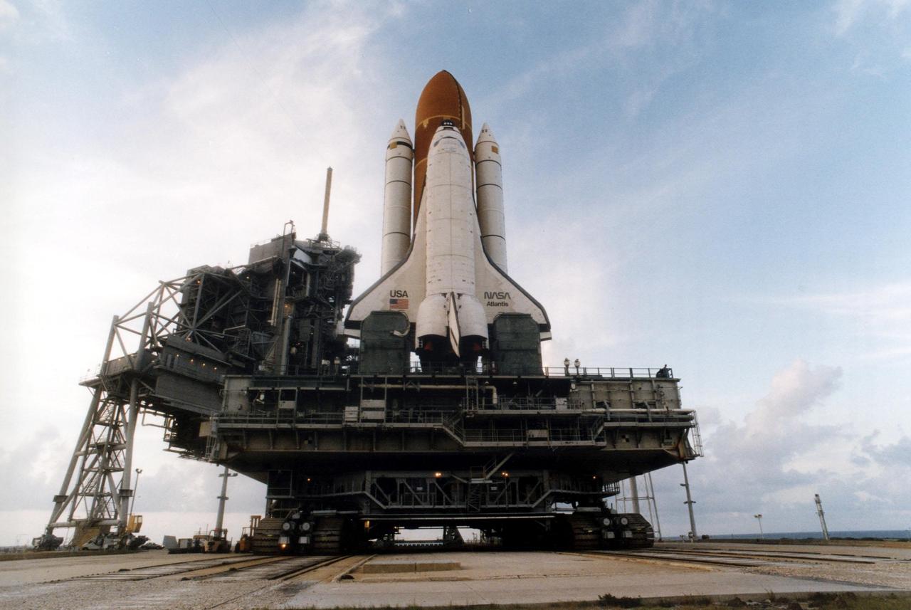 KENNEDY SPACE CENTER, FLA. -- Atlantis, with its new external tank/solid rocket booster stack, rolls out to Pad 39A on August 20, 1996, in preparation for launch of STS-79 on the fourth Mir docking mission. Atlantis will return Astronaut Shannon Lucid to Earth after her record-breaking stay by an American on the Russian space  station. Lucid has completed 21 weeks in space this week. Astronaut John Blaha will trade places with Lucid for a planned four-month stay aboard Mir. Atlantis will also carry the first SPACEHAB Double Module.