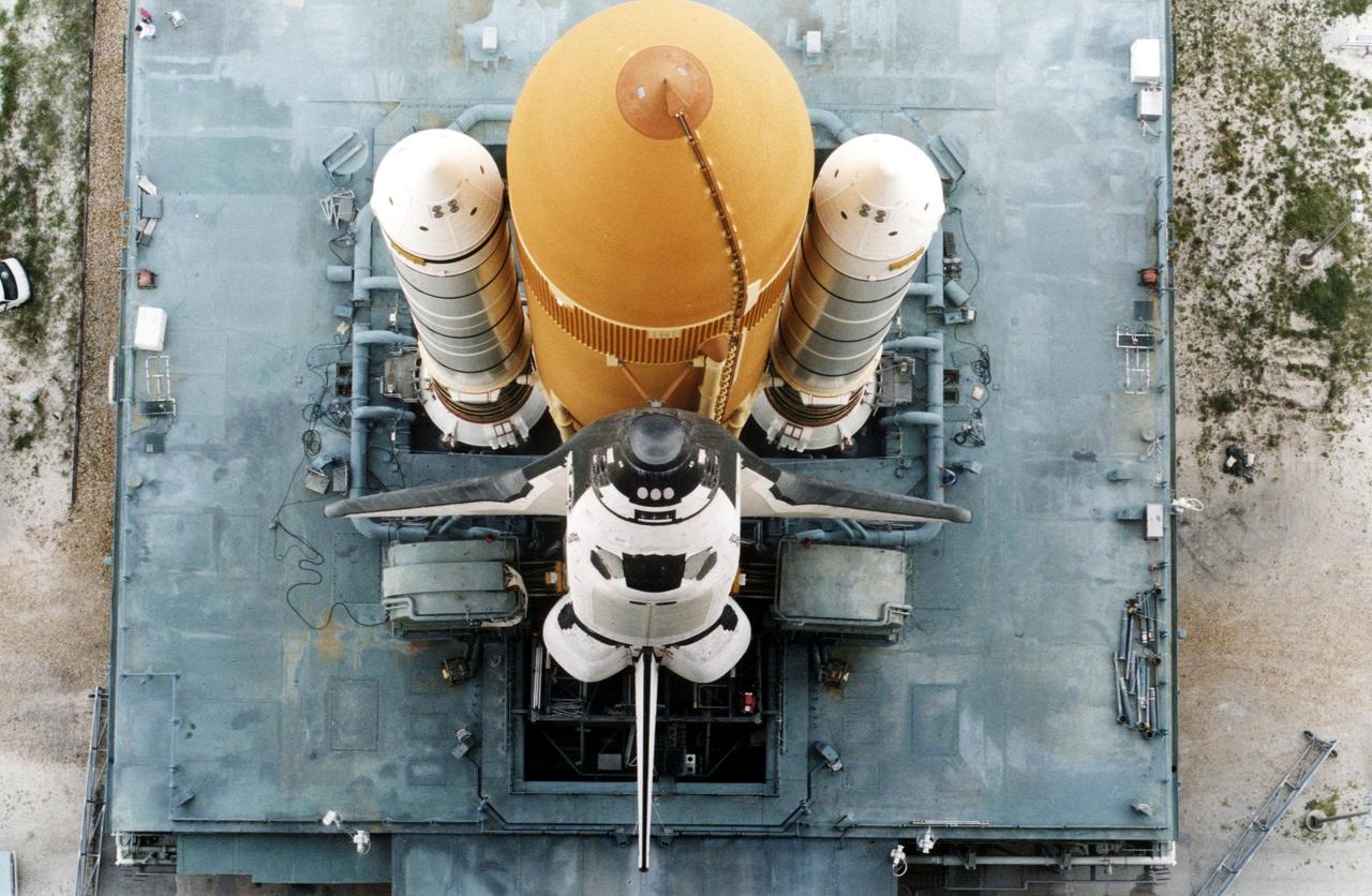 KENNEDY SPACE CENTER, FLA. -- Atlantis, with its new external tank/solid rocket booster stack, rolls out to Pad 39A on August 20, 1996, in preparation for launch of STS-79 on the fourth Mir docking mission. Atlantis will return Astronaut Shannon Lucid to Earth after her record-breaking stay by an American on the Russian space station. Lucid has completed 21 weeks in space this week. Astronaut John Blaha will trade places with Lucid for a planned four-month stay aboard Mir. Atlantis will also carry the first SPACEHAB Double Module