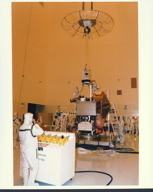 NASA image: KENNEDY SPACE CENTER, FLA. -  In the Payload Hazardous Servicing Facility at KSC, installation is under way of the Mars Orbiter Camera (MOC) on the Mars Global Surveyor spacecraft.  The MOC is one of a suite of six scientific instruments that will gather data about Martian topography, mineral distribution and weather during a two-year period.  The Mars Global Surveyor is slated for launch aboard a Delta II expendable launch vehicle on Nov. 6, the beginning of a 20-day launch period.