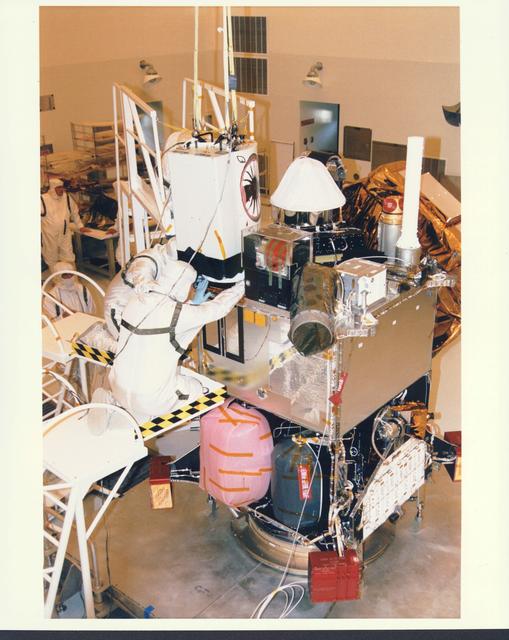 NASA image: KENNEDY SPACE CENTER, FLA. -  In the Payload Hazardous Servicing Facility at KSC, installation is under way of the Mars Orbiter Camera (MOC) on the Mars Global Surveyor spacecraft.  The MOC is one of a suite of six scientific instruments that will gather data about Martian topography, mineral distribution and weather during a two-year period.  The Mars Global Surveyor is slated for launch aboard a Delta II expendable launch vehicle on Nov. 6, the beginning of a 20-day launch period.