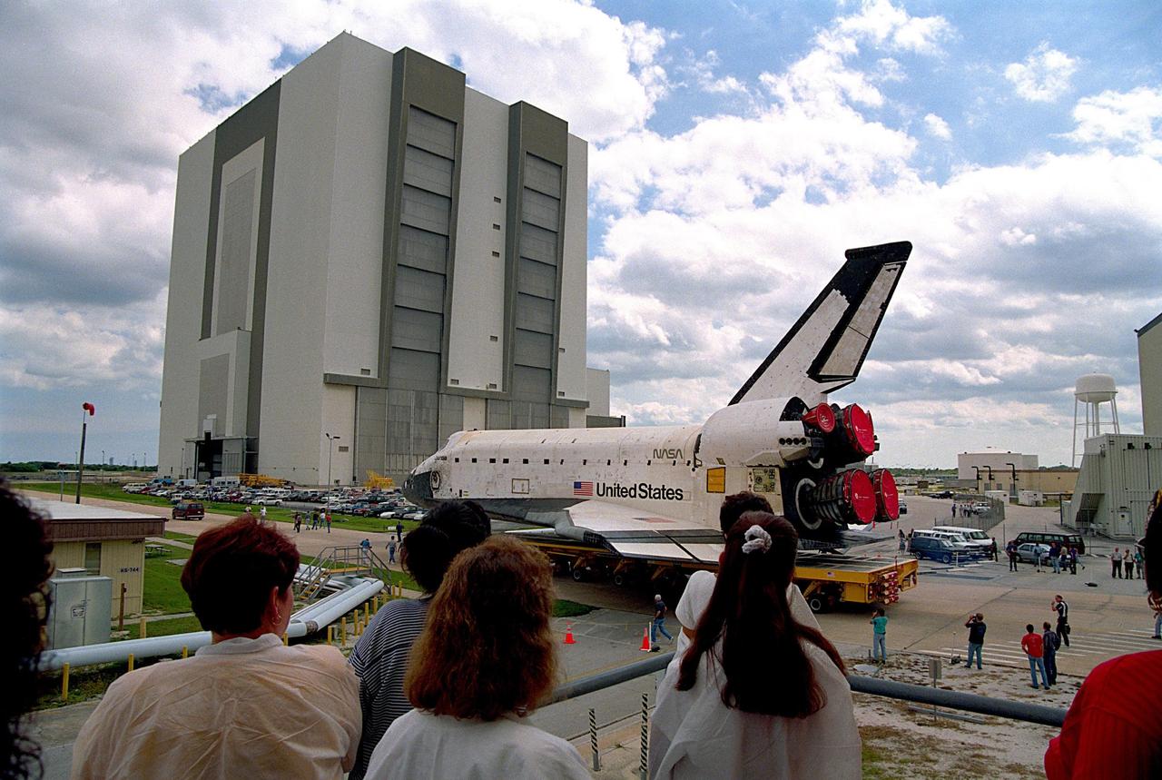KENNEDY SPACE CENTER, FLA. -- The orbiter Columbia completes the short journey from Orbiter Processing Facility Bay 1 to the Vehicle Assembly Building (VAB). During its approximately one-week stay inside the VAB, the spaceplane will be mated to the external tank and twin solid rocket boosters, and electrical and mechanical interfaces will be verified. Rollout to Launch Pad 39B is planned for Oct. 16, where the two primary payloads of the upcoming STS-80 mission -- the Wake Shield Facility-3 (WSF-3) and Orbiting and Retrievable Far and Extreme Ultraviolet Spectrograph-Shuttle Pallet Satellite-2 (ORFEUS-SPAS-2) -- will be installed. Liftoff on the final Shuttle flight of 1996 is targeted for no earlier than Nov 8 at 2:47 p.m. EST