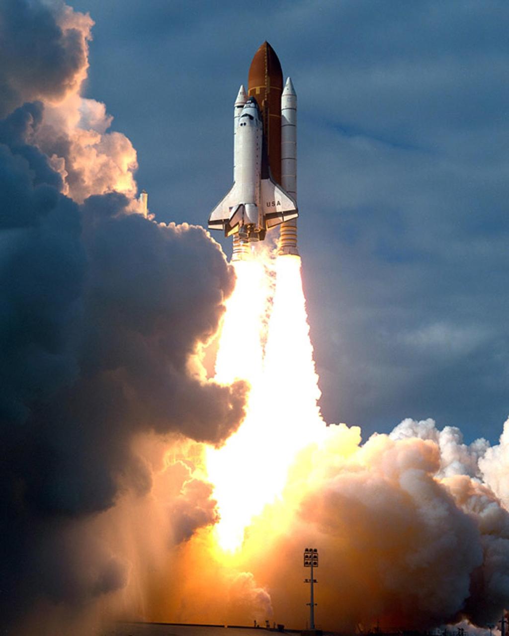 KENNEDY SPACE CENTER, FLA. -- A diversified mission of astronomy, commercial space research and International Space Station preparation gets under way as the Space Shuttle Columbia climbs into orbit from Launch Pad 39B at 2:55:47 p.m. EST, Nov. 19, 1996. During Mission STS- 80, Columbia’s five-person crew will deploy and retrieve two free-flying spacecraft, conduct two spacewalks and perform a variety of microgravity research experiments in the Shuttle’s middeck area. The veteran crew is led by Commander Kenneth D. Cockrell; Kent V. Rominger is the pilot and the three mission specialists are Tamara E. Jernigan, Story Musgrave and Thomas D. Jones. At age 61, Musgrave becomes the oldest person ever to fly in space; he also ties astronaut John Young’s record for most number of spaceflights by a human being, and in embarking on his sixth Shuttle flight Musgrave has logged the most flights ever aboard NASA’s reusable space vehicle. The two primary payloads for STS-80 are the Wake Shield Facility-3 (WSF-3) and the Orbiting and Retrievable Far and Extreme Ultraviolet Spectrometer-Shuttle Pallet Satellite II (ORFEUS-SPAS II).    