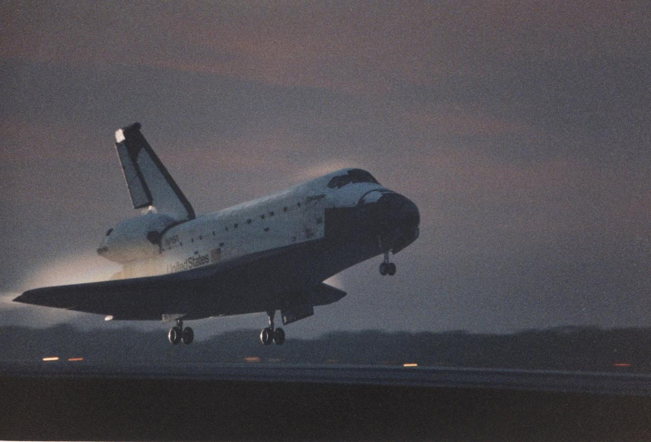 KENNEDY SPACE CENTER, FLA. -- With sunrise just minutes away, the orbiter Columbia swoops down on KSC’s Shuttle Landing Facility, Runway 33. The 33rd KSC landing in Shuttle program history is set to occur on the first opportunity Dec. 7 at 6:49 a.m. EST. Prior landing attempts Dec. 5 and 6 were scrubbed due to weather conditions. The extended time aloft allowed the five- member crew of Mission STS-80 to set a new record for long-duration Shuttle flight. At main gear touchdown, mission duration will be about 17 days, 16 hours, surpassing the 16-day, 21-hour set by the STS-78 crew earlier this year. Guiding Columbia onto the runway is STS-80 Commander Kenneth D. Cockrell; the pilot is Kent V. Rominger. The three mission specialists are Tamara E. Jernigan, Thomas D. Jones and Story Musgrave