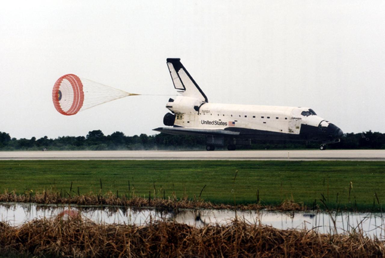 KENNEDY SPACE CENTER, FLA. -- The drag chute pops open as the orbiter Columbia glides down Runway 33 of the Kennedy Space Center's Shuttle Landing Facility. Main gear touchdown occurred at 8:36 a.m. EDT, July 7, 1996. A mission duration of 16 days, 21 hours, and 47 minutes made STS-78 the longest Shuttle flight to date. On board are a crew of seven: mission Commander Terence "Tom" Henricks; Pilot Kevin R. Kregel; Payload Commander Susan J. Helms; Mission Specialists Richard M. Linnehan and Charles E. Brady Jr.; and Payload Specialist Jean-Jacques Favier, representing the French Space Agency (CNES) and Robert Brent Thirsk, of the Canadian Space Agency (CSA) . The primary payload of the 78th Shuttle flight was the Life and Microgravity Spacelab (LMS)