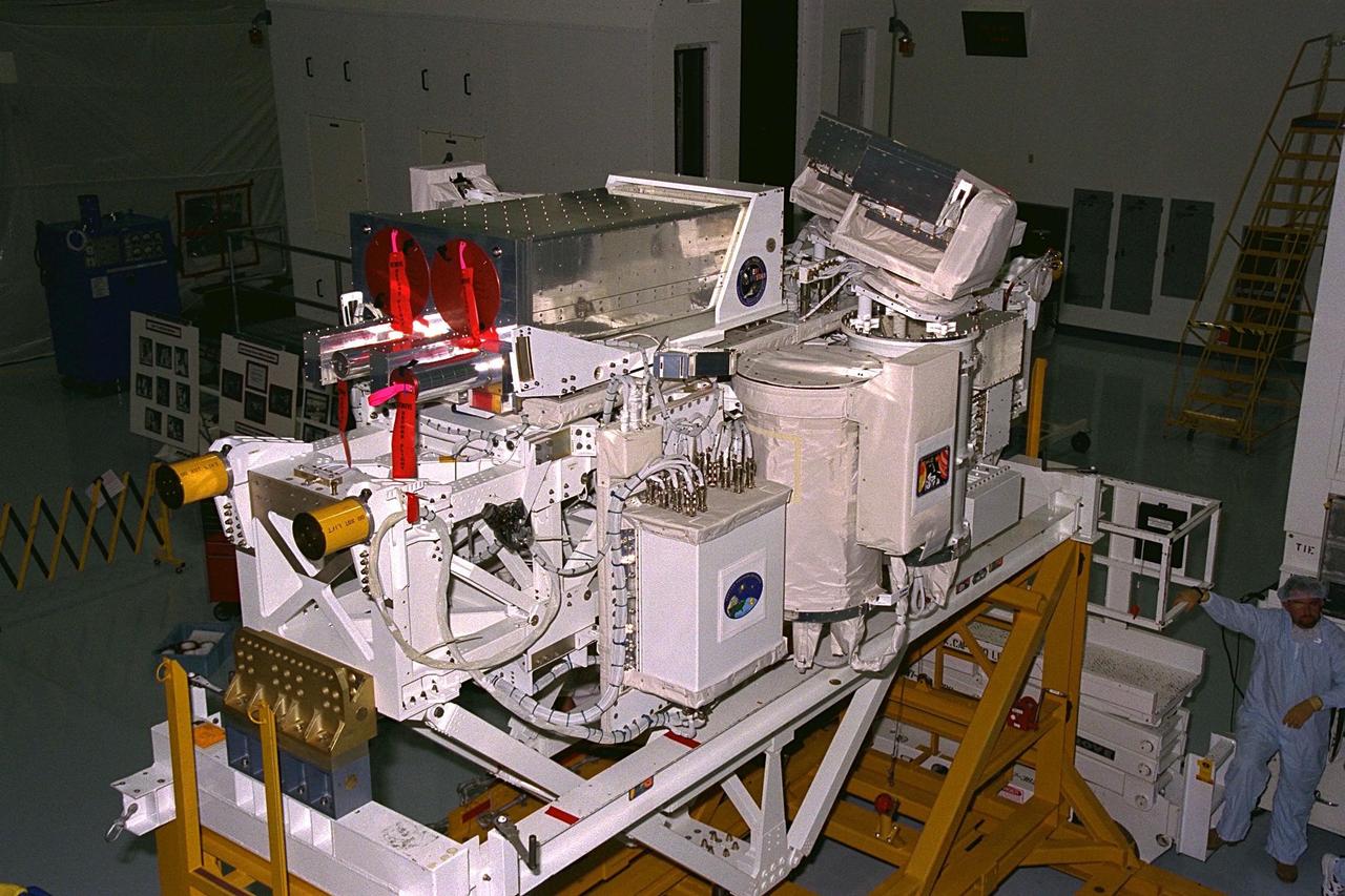 The International Extreme Ultraviolet  Hitchhiker-2 (IEH-2) payload rests in a work stand in the Space Station Processing  Facility prior to its trip out to Launch Pad 39A for installation into the payload bay of the  Space Shuttle Orbiter Discovery for the STS-85 mission. The IEH-2 experiments will  study ultraviolet radiation from stars, the sun and in the solar system. The Technology  Applications and Science-1 (TAS-1) payload is another series of experiments that will be  conducted during the 11-day mission in Discovery’s payload bay. The TAS-1 holds seven  separate experiments that will provide data on the Earth’s topography and atmosphere,  study the sun’s energy, and test new thermal control devices, as well as several student-developed experiments. Other STS-85 payloads include the Cryogenic Infrared  Spectrometers and Telescopes for the Atmosphere-Shuttle Pallet Satellite-2 (CRISTA-SPAS-2). The CRISTA is a system of three telescopes and four spectrometers to measure  infrared radiation emitted by the Earth’s middle atmosphere. The CRISTA-SPAS-2 free-flying satellite will be deployed from Discovery and retrieved later in the flight. Also  onboard the satellite will be the Middle Atmosphere High Resolution Spectrograph  Investigation (MAHRSI) to measure ultraviolet radiation emitted and scattered by the  Earth’s atmosphere