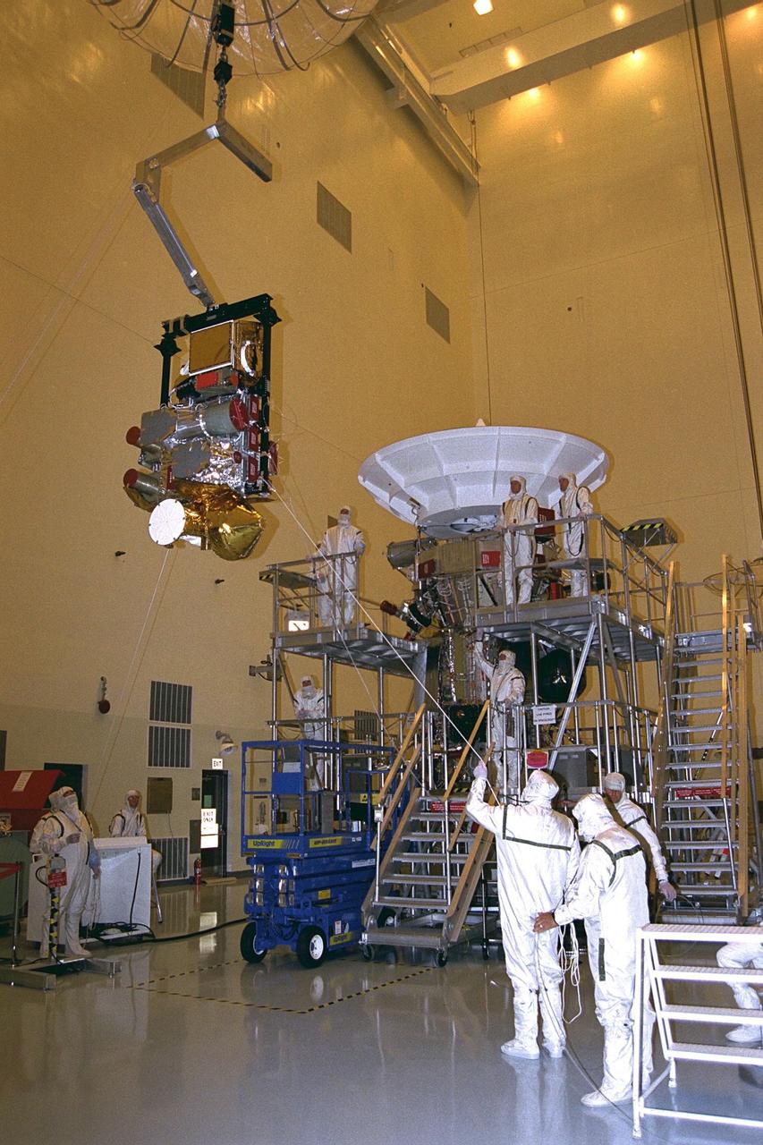 The complete remote sensing pallet is lowered by technicians from the Jet Propulsion Laboratory (JPL) of the California Institute of Technology to mate with the Cassini spacecraft in the Payload Hazardous Servicing Facility at KSC in July. A four-year, close-up study of the Saturnian system, the Cassini mission is scheduled for launch from Cape Canaveral Air Station in October 1997. It will take seven years for the spacecraft to reach Saturn. Scientific instruments carried aboard the spacecraft will study Saturn’s atmosphere, magnetic field, rings, and several moons. JPL is managing the Cassini project for NASA