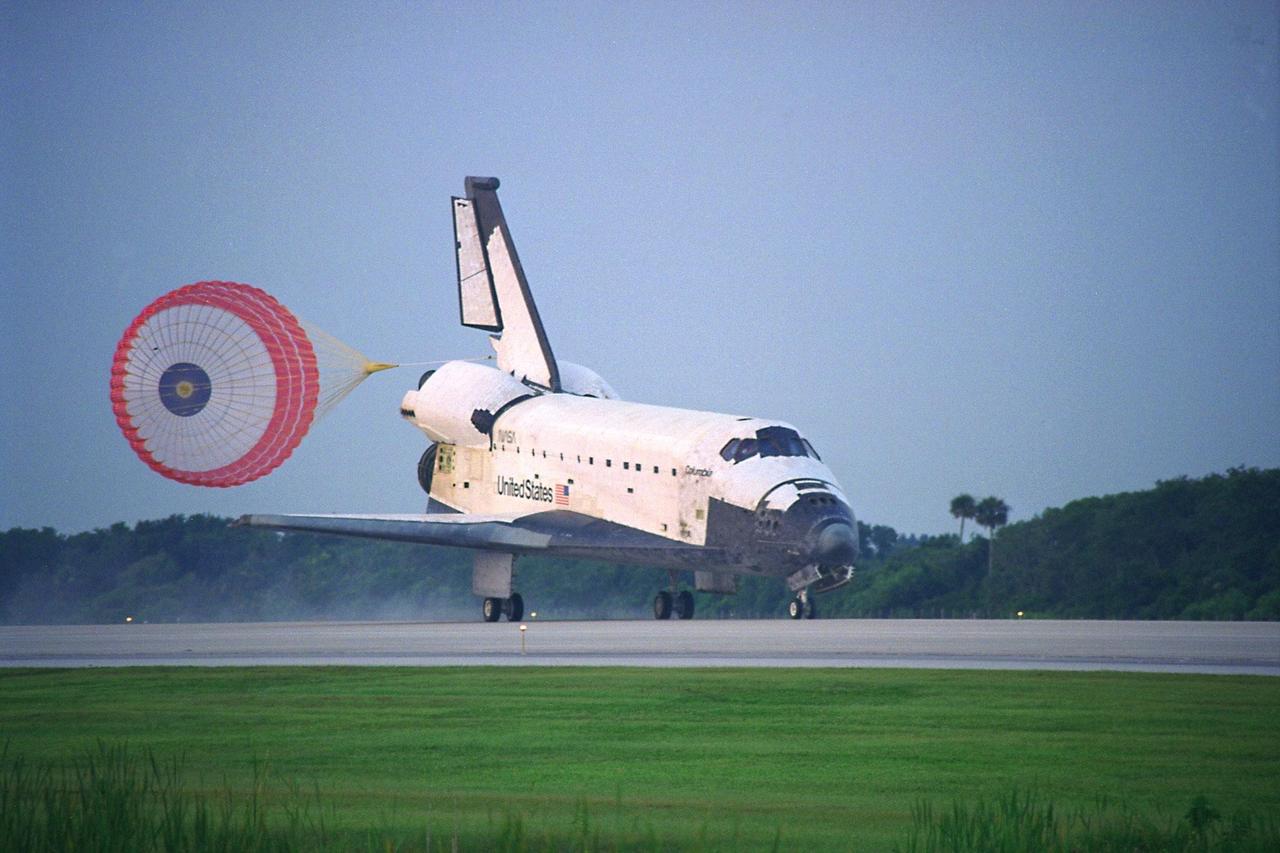 KENNEDY SPACE CENTER, FLA. -- With its drag chute deployed, the Space Shuttle  Orbiter Columbia touches down on Runway 33 at KSC’s Shuttle Landing Facility at  6:46:34 a.m. EDT  with Mission Commander  James D. Halsell Jr. and Pilot Susan L.  Still at the controls to complete the STS-94 mission. Also on board are Mission Specialist  Donald A. Thomas, Mission Specialist Michael L. Gernhardt , Payload Commander  Janice Voss, and Payload Specialists Roger  K.  Crouch and Gregory T. Linteris. Mission  elapsed time for STS-94 was 15 days,16 hours, 44 seconds. During the Microgravity  Science Laboratory-1 (MSL-1) mission, the Spacelab module was used to test some of the  hardware, facilities and procedures that are planned for use on the International Space  Station while the flight crew conducted combustion, protein crystal growth and materials  processing experiments. This mission was a reflight of  the STS-83 mission that lifted off   from KSC in April of this year. That space flight was cut short due to indications of a  faulty fuel cell. This was Columbia’s 11th landing at KSC and the 38th landing at the  space center in the history of the Shuttle program