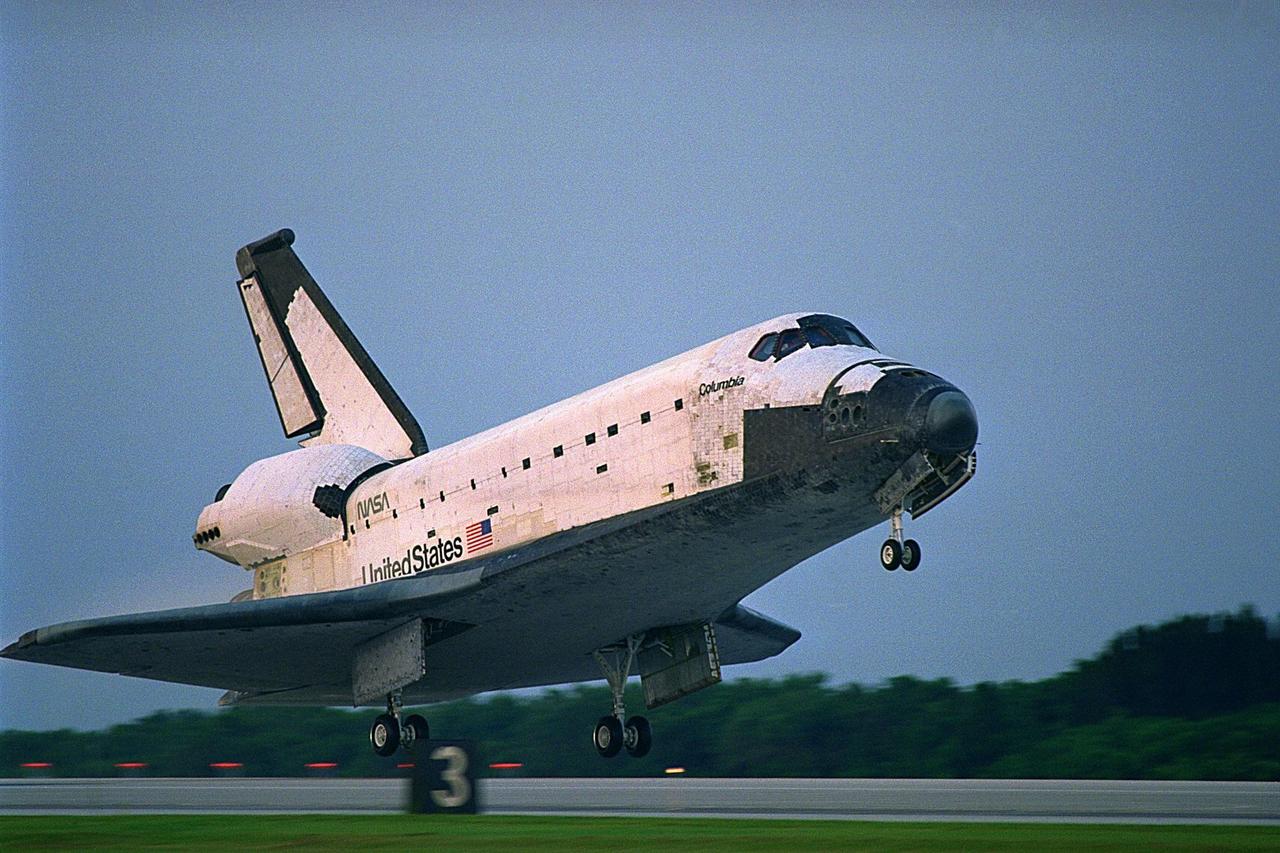 KENNEDY SPACE CENTER, FLA. -- The Space Shuttle orbiter Columbia touches  down on Runway 33 at KSC’s Shuttle Landing Facility at 6:46:34 a.m. EDT with  Mission Commander  James D. Halsell Jr. and Pilot Susan L. Still at the controls to  complete the STS-94 mission. Also on board are Mission Specialist Donald A. Thomas,  Mission Specialist Michael L. Gernhardt, Payload Commander Janice Voss, and Payload  Specialists Roger K. Crouch and Gregory T. Linteris. During the Microgravity Science  Laboratory-1 (MSL-1) mission, the Spacelab module was used to test some of the  hardware, facilities and procedures that are planned for use on the International Space  Station while the flight crew conducted combustion, protein crystal growth and materials  processing experiments. This mission was a reflight of  the STS-83 mission that lifted off   from KSC in April of this year. That space flight was cut short due to indications of a  faulty fuel cell. This was Columbia’s 11th landing at KSC and the 38th landing at the  space center in the history of the Shuttle program