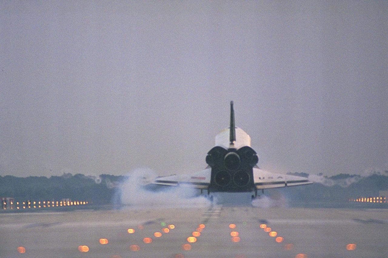 KENNEDY SPACE CENTER, FLA. -- The Space Shuttle orbiter Columbia touches  down on Runway 33 at KSC’s Shuttle Landing Facility at 6:46:34 a.m. EDT with  Mission Commander  James D. Halsell Jr. and Pilot Susan L. Still at the controls to  complete the STS-94 mission. Also on board are Mission Specialist Donald A. Thomas,  Mission Specialist Michael L. Gernhardt, Payload Commander Janice Voss, and Payload  Specialists Roger K. Crouch and Gregory T. Linteris. During the Microgravity Science  Laboratory-1 (MSL-1) mission, the Spacelab module was used to test some of the  hardware, facilities and procedures that are planned for use on the International Space  Station while the flight crew conducted combustion, protein crystal growth and materials  processing experiments. This mission was a reflight of  the STS-83 mission that lifted off   from KSC in April of this year. That space flight was cut short due to indications of a  faulty fuel cell. This was Columbia’s 11th landing at KSC and the 38th landing at the  space center in the history of the Shuttle program