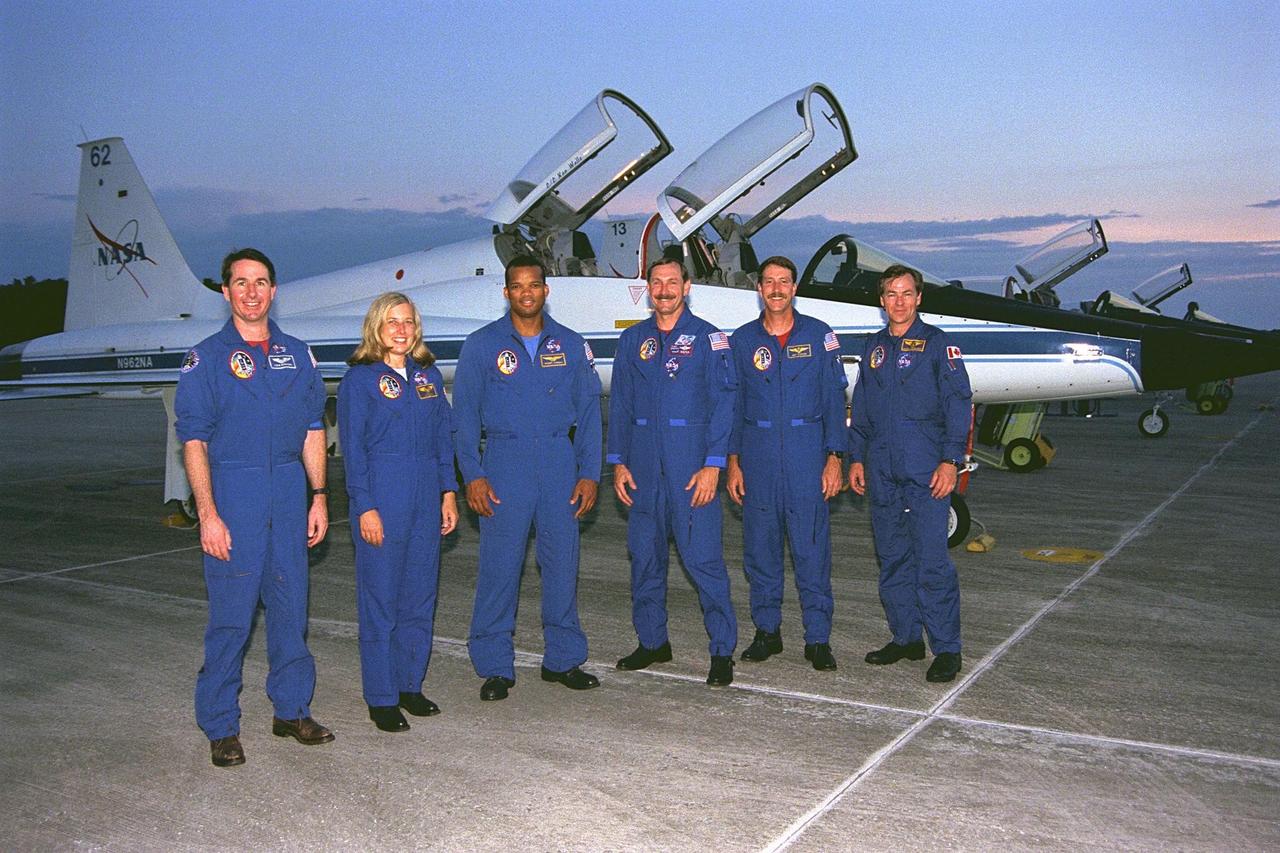 The STS-85 mission crew members pose in front of their T-38 jet trainers after they arrived at KSC’s Shuttle Landing Facility from NASA’s Johnson Space Center to begin Terminal Countdown Demonstration Test (TCDT) activities for that mission. The TCDT includes a dress rehearsal of the launch countdown. They are (front row, from left): Mission Specialist Stephen K. Robinson; Payload Commander N. Jan Davis; Mission Specialist Robert L. Curbeam, Jr.; Commander Curtis L. Brown, Jr.; Pilot Kent V. Rominger; and Payload Specialist Bjarni V. Tryggvason. The STS-85 mission is now targeted for Aug. 7. The primary payload aboard the Space Shuttle orbiter Discovery is the Cryogenic Infrared Spectrometers and Telescopes for the Atmosphere-2 (CRISTA-SPAS-2). Other STS-85 payloads include the Manipulator Flight Demonstration (MFD), and Technology Applications and Science-1 (TAS-1) and International Extreme Ultraviolet Hitchhiker-2 (IEH-2) experiments