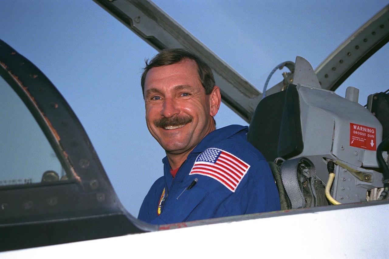 STS-85 Mission Commander Curtis L. Brown,  Jr., poses in his T-38 jet trainer after landing with his crew at KSC’s Shuttle Landing  Facility from NASA’s Johnson Space Center to begin Terminal Countdown  Demonstration Test (TCDT) activities for that mission. The TCDT includes a dress  rehearsal of the launch countdown. The STS-85 mission is now targeted for Aug. 7. The  primary payload aboard the Space Shuttle orbiter Discovery is the Cryogenic Infrared  Spectrometers and Telescopes for the Atmosphere-2 (CRISTA-SPAS-2). Other STS-85  payloads include the Manipulator Flight Demonstration (MFD), and Technology  Applications and Science-1 (TAS-1) and International Extreme Ultraviolet Hitchhiker-2  (IEH-2) experiments