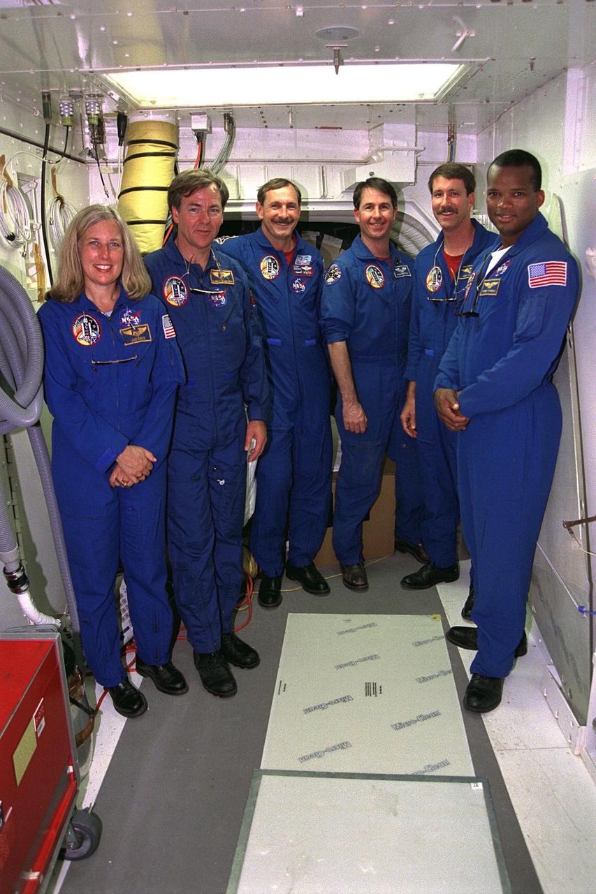 The STS-85 flight crew poses in the white room  at Launch Pad 39A during a break in Terminal Countdown Demonstration Test (TCDT)  activities for that mission. They are (from left): Payload Commander N. Jan Davis;  Payload Specialist Bjarni V. Tryggvason; Commander Curtis L. Brown, Jr.; Mission  Specialist Stephen K. Robinson; Pilot Kent V. Rominger; and Mission Specialist Robert  L. Curbeam, Jr.  The primary payload aboard the Space Shuttle orbiter Discovery is the  Cryogenic Infrared Spectrometers and Telescopes for the Atmosphere-2 (CRISTA-SPAS-2). Other payloads on the 11-day mission include the Manipulator Flight Demonstration  (MFD), and Technology Applications and Science-1 (TAS-1) and International Extreme  Ultraviolet Hitchhiker-2 (IEH-2) experiments