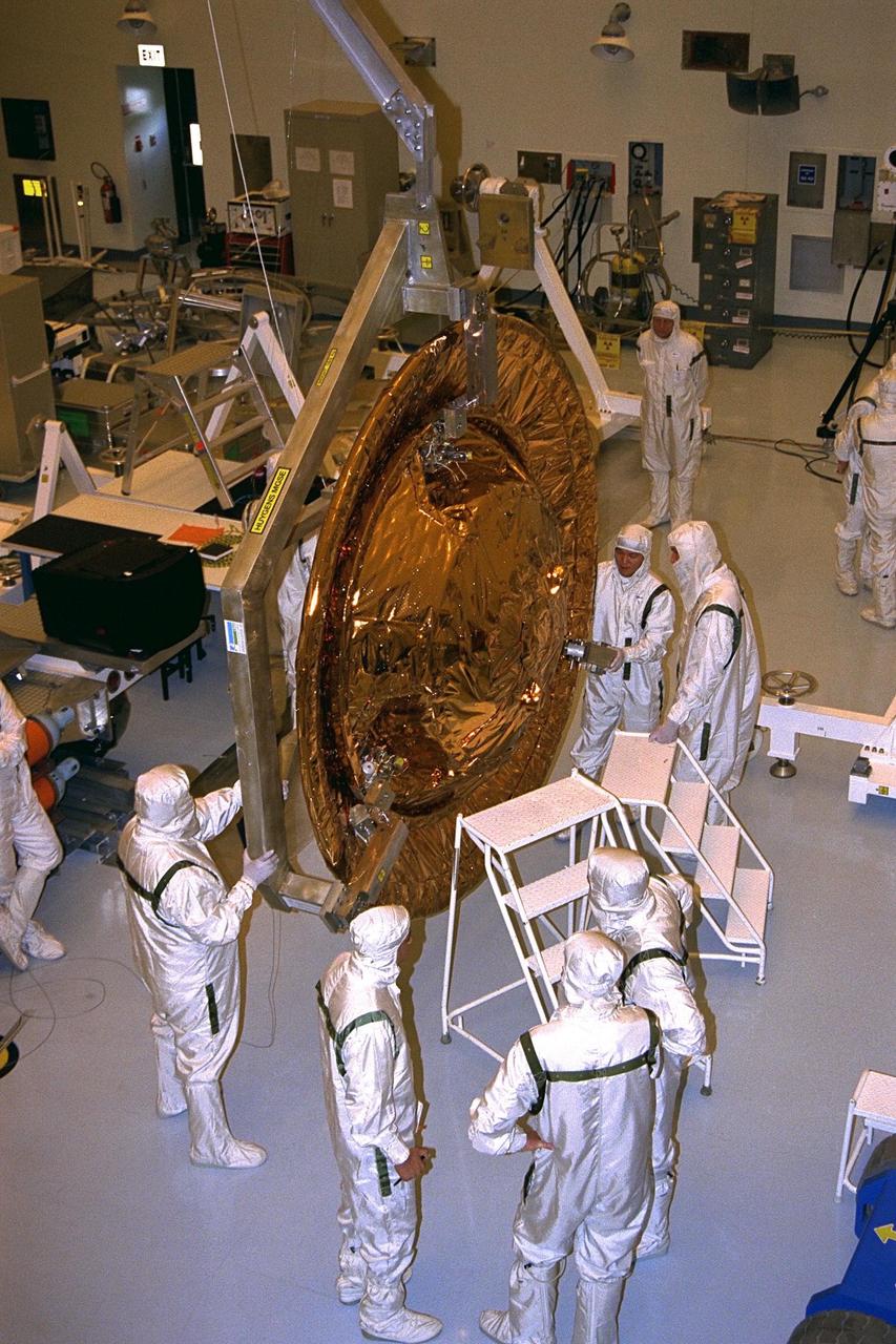The Huygens probe is installed into the Cassini orbiter in the Payload Hazardous Servicing Facility (PHSF)