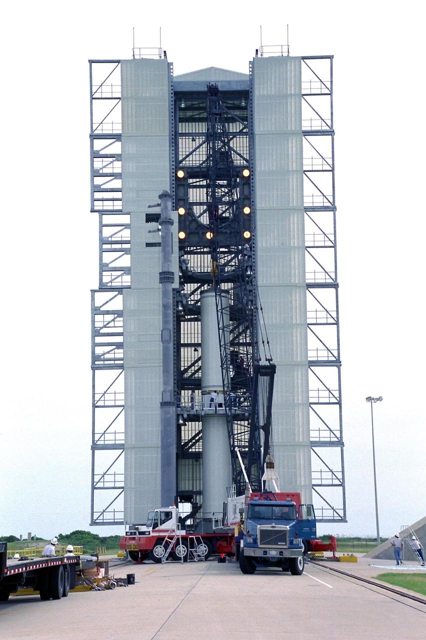 The second stage of the Lockheed Martin Launch  Vehicle-2 (LMLV-2) is mated to its first stage at Launch Complex 46 at Cape Canaveral  Air Station. The LMLV-2 will carry the Lunar Prospector spacecraft, scheduled to launch  in October for an 18-month mission that will orbit the Earth’s moon to collect data from  the lunar surface. Information gathered during the mission will allow construction of a  detailed map of the surface composition of the moon and will improve our understanding  of its origin, evolution, current state, and resources