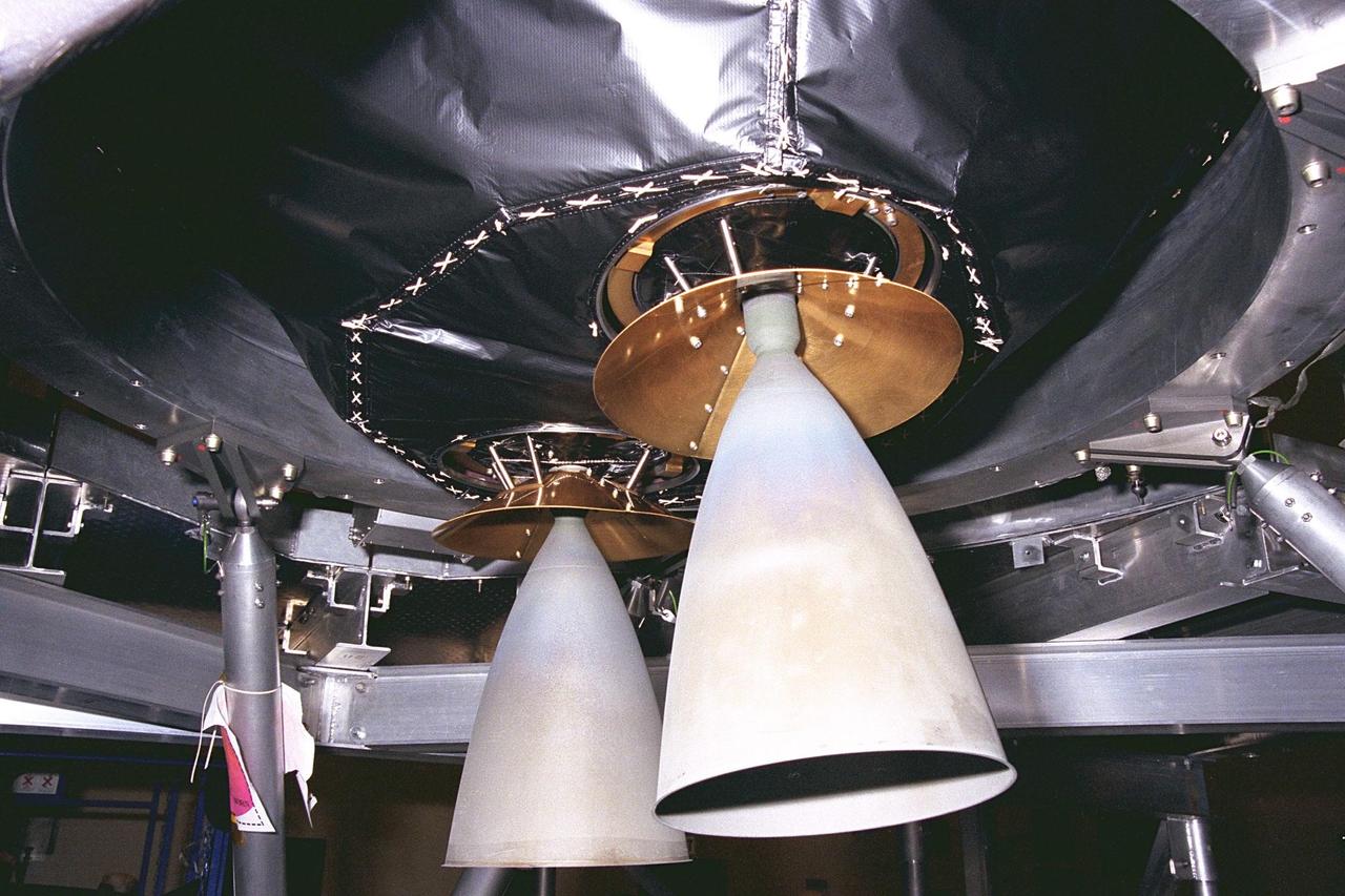 The main engine thruster nozzles of the Cassini spacecraft have their covers removed prior to the securing of the craft to its launch vehicle adapter in KSC’s Payload Hazardous Servicing Facility. The main engines of Cassini will be used for Deep Space Maneuver burns, which will be performed periodically throughout its cruise to Saturn to keep the spacecraft on the correct trajectory. Large maneuvers (such as a change in spacecraft speed of about one meter per second or higher) will be done with the main engine, whereas smaller maneuvers will be performed by the thrusters and/or reaction wheels. Scheduled for launch in October, the Cassini mission seeks insight into the origins and evolution of the early solar system. It will take seven years for the spacecraft to reach Saturn
