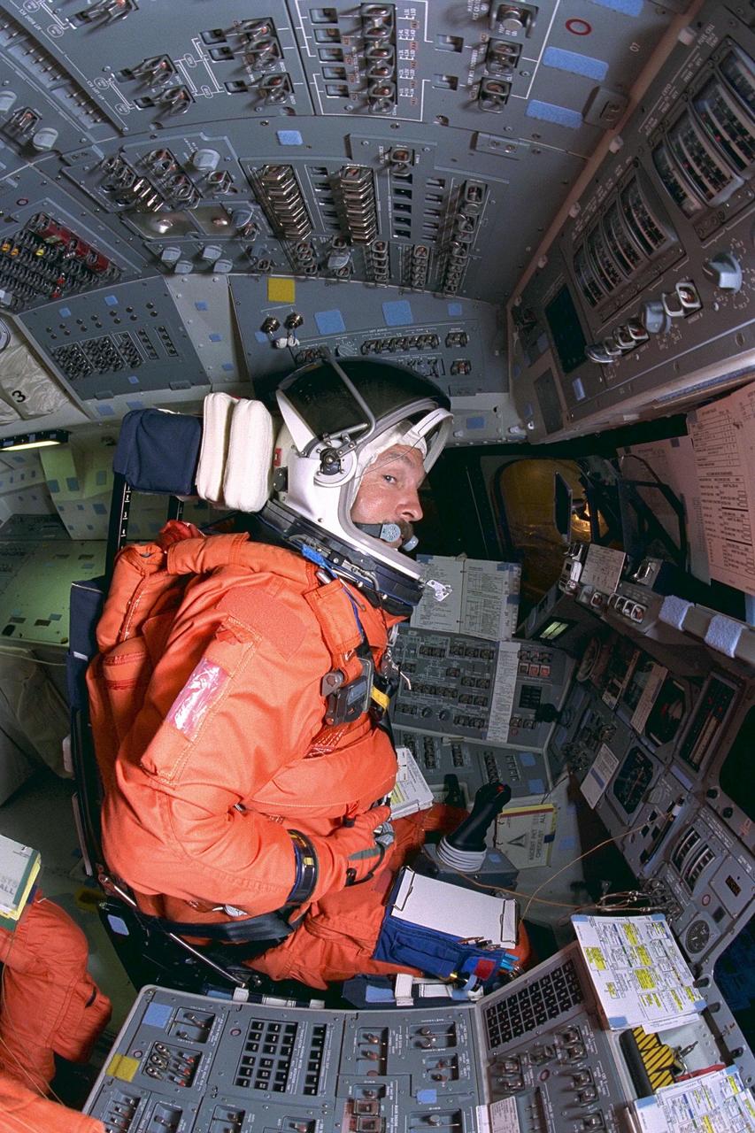 KENNEDY SPACE CENTER, FLA. -- STS-85 Commander Curtis L. Brown, Jr., goes  through countdown procedures on the flight deck aboard the Space Shuttle orbiter  Discovery during Terminal Countdown Demonstration Test (TCDT) activities for that  mission. The TCDT includes a simulation of the final launch countdown. The primary  payload aboard the Space Shuttle orbiter Discovery is the Cryogenic Infrared  Spectrometers and Telescopes for the Atmosphere-2 (CRISTA-SPAS-2). Other STS-85  payloads include the Manipulator Flight Demonstration (MFD),  and Technology  Applications and Science-1 (TAS-1) and International Extreme Ultraviolet Hitchhiker-2  (IEH-2) experiments