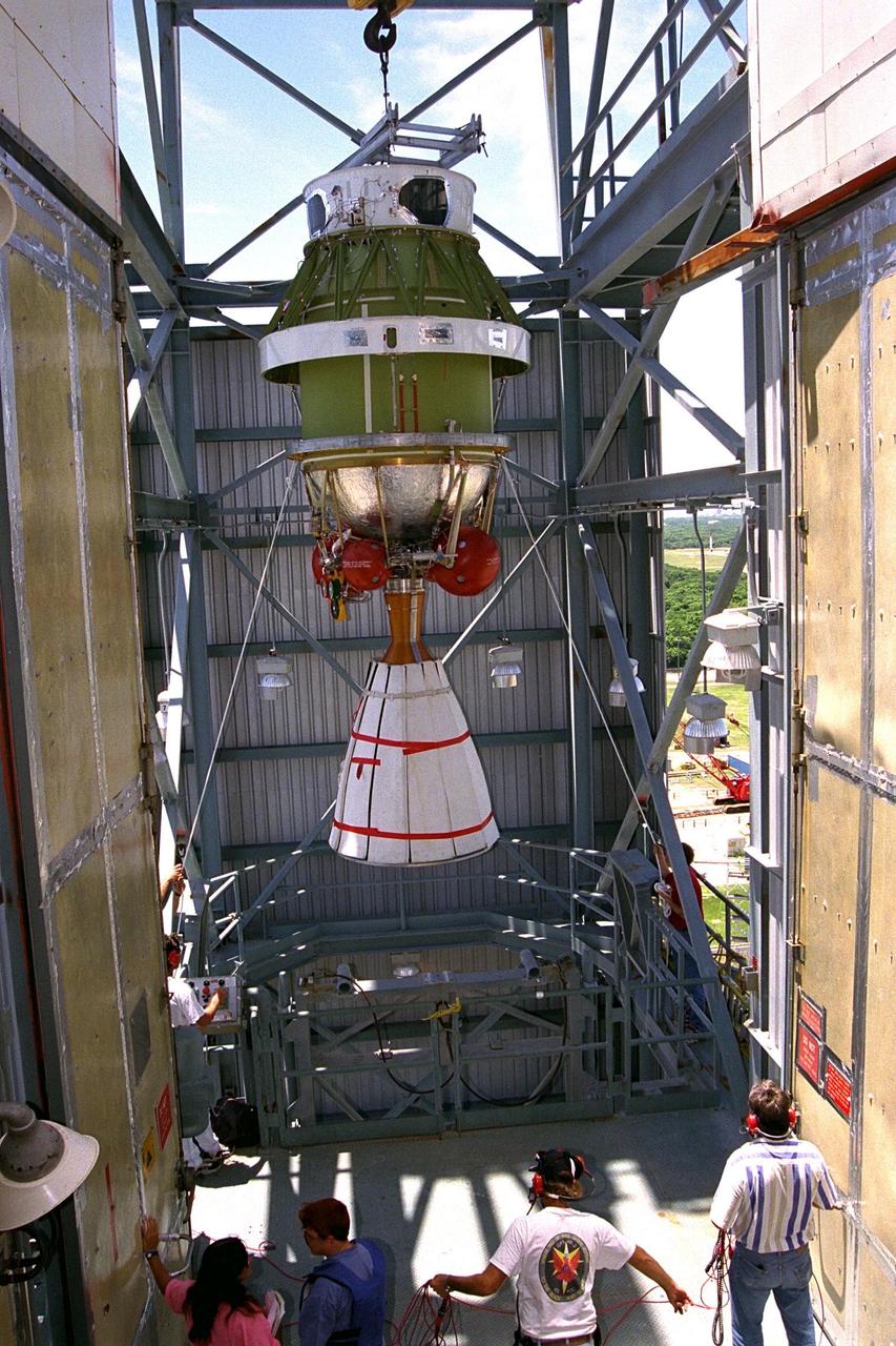 The second stage of the Delta II rocket which will to be used to launch the Advanced Composition Explorer (ACE) spacecraft is erected at Launch Complex 17A at Cape Canaveral Air Station. Scheduled for launch on Aug. 25, ACE will study low-energy particles of solar origin and high-energy galactic particles. The ACE observatory will be placed into an orbit almost a million miles (1.5 million kilometers) away from the Earth, about 1/100 the distance from the Earth to the Sun