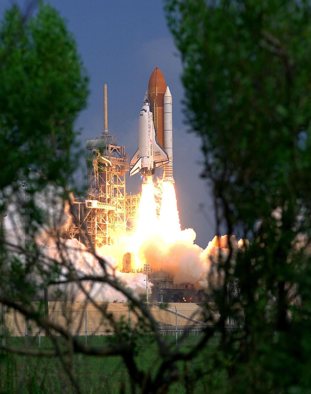 KENNEDY SPACE CENTER, Fla. -- Blasting through the hazy late morning sky, the Space Shuttle Discovery soars from Launch Pad 39A at 10:41 a.m. EDT Aug. 7 on the 11-day STS-85 mission. Aboard Discovery are Commander Curtis L. Brown, Jr.; Pilot Kent V. Rominger, Payload Commander N. Jan Davis, Mission Specialist Robert L. Curbeam, Jr., Mission Specialist Stephen K. Robinson and Payload Specialist Bjarni V. Tryggvason, a Canadian Space Agency astronaut . The primary payload aboard the Space Shuttle orbiter Discovery is the Cryogenic Infrared Spectrometers and Telescopes for the Atmosphere-Shuttle Pallet Satellite-2 (CRISTA-SPAS-2) free-flyer. The CRISTA-SPAS-2 will be deployed on flight day 1 to study trace gases in the Earth’s atmosphere as a part of NASA’s Mission to Planet Earth program. Also aboard the free-flying research platform will be the Middle Atmosphere High Resolution Spectrograph Instrument (MAHRSI). Other payloads on the 11-day mission include the Manipulator Flight Demonstration (MFD), a Japanese Space Agency-sponsored experiment. Also in Discovery’s payload bay are the Technology Applications and Science-1 (TAS-1) and International Extreme Ultraviolet Hitchhiker-2 (IEH-2) experiments
