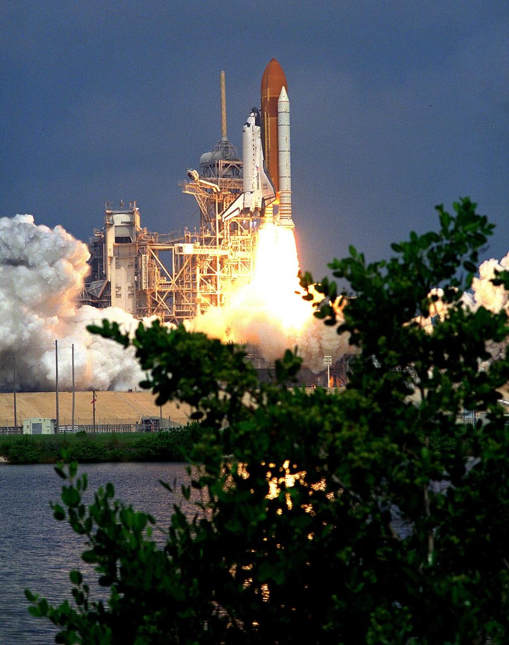 KENNEDY SPACE CENTER, Fla. -- Blasting through the hazy late morning sky, the Space Shuttle Discovery soars from Launch Pad 39A at 10:41 a.m. EDT Aug. 7 on the 11-day STS-85 mission. Aboard Discovery are Commander Curtis L. Brown, Jr.; Pilot Kent V. Rominger, Payload Commander N. Jan Davis, Mission Specialist Robert L. Curbeam, Jr., Mission Specialist Stephen K. Robinson and Payload Specialist Bjarni V. Tryggvason, a Canadian Space Agency astronaut . The primary payload aboard the Space Shuttle orbiter Discovery is the Cryogenic Infrared Spectrometers and Telescopes for the Atmosphere-Shuttle Pallet Satellite-2 (CRISTA-SPAS-2) free-flyer. The CRISTA-SPAS-2 will be deployed on flight day 1 to study trace gases in the Earth’s atmosphere as a part of NASA’s Mission to Planet Earth program. Also aboard the free-flying research platform will be the Middle Atmosphere High Resolution Spectrograph Instrument (MAHRSI). Other payloads on the 11-day mission include the Manipulator Flight Demonstration (MFD), a Japanese Space Agency-sponsored experiment. Also in Discovery’s payload bay are the Technology Applications and Science-1 (TAS-1) and International Extreme Ultraviolet Hitchhiker-2 (IEH-2) experiments
