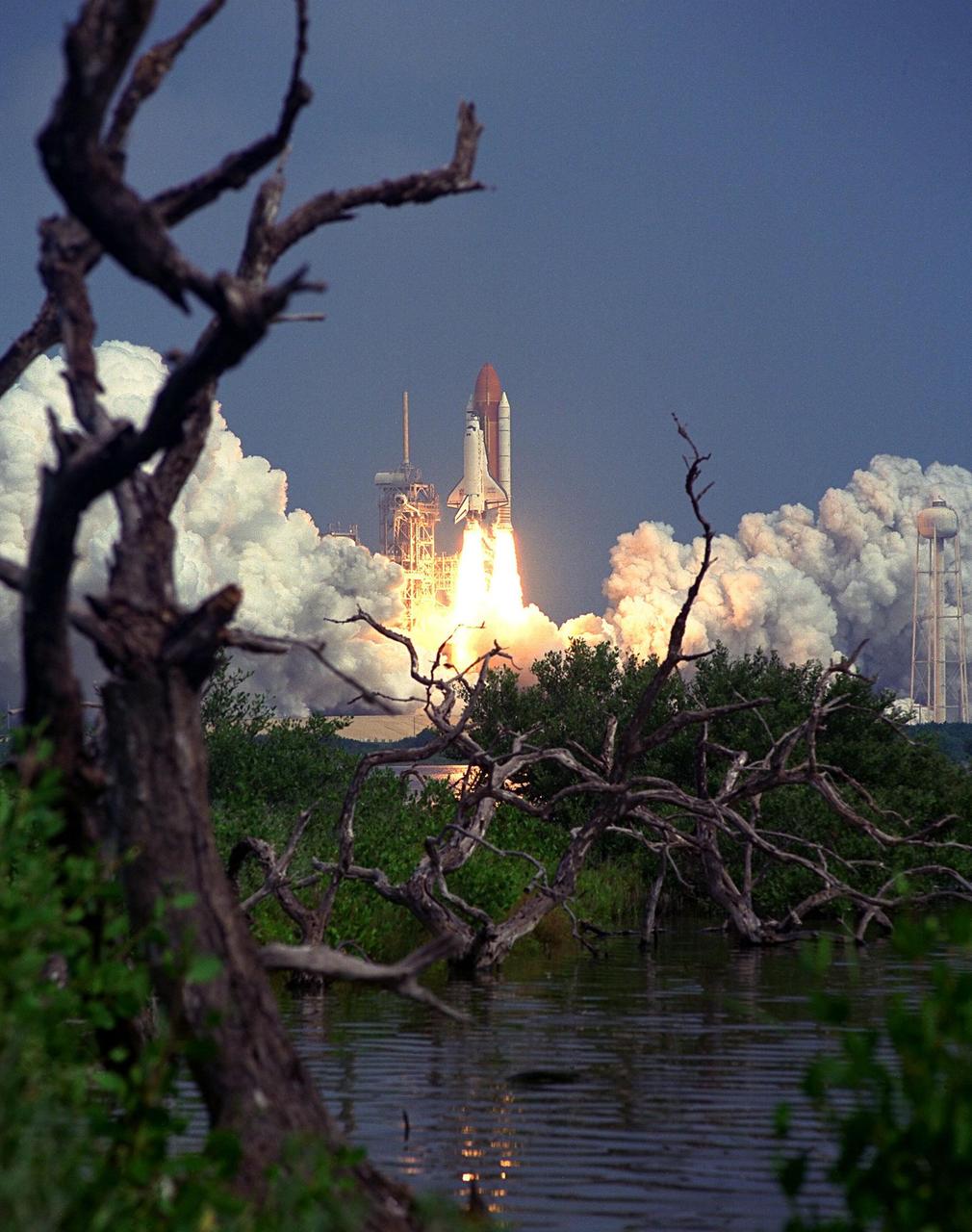 KENNEDY SPACE CENTER, Fla. -- Blasting through the hazy late morning sky, the Space Shuttle Discovery soars from Launch Pad 39A at 10:41 a.m. EDT Aug. 7 on the 11-day STS-85 mission. Aboard Discovery are Commander Curtis L. Brown, Jr.; Pilot Kent V. Rominger, Payload Commander N. Jan Davis, Mission Specialist Robert L. Curbeam, Jr., Mission Specialist Stephen K. Robinson and Payload Specialist Bjarni V. Tryggvason, a Canadian Space Agency astronaut . The primary payload aboard the Space Shuttle orbiter Discovery is the Cryogenic Infrared Spectrometers and Telescopes for the Atmosphere-Shuttle Pallet Satellite-2 (CRISTA-SPAS-2) free-flyer. The CRISTA-SPAS-2 will be deployed on flight day 1 to study trace gases in the Earth’s atmosphere as a part of NASA’s Mission to Planet Earth program. Also aboard the free-flying research platform will be the Middle Atmosphere High Resolution Spectrograph Instrument (MAHRSI). Other payloads on the 11-day mission include the Manipulator Flight Demonstration (MFD), a Japanese Space Agency-sponsored experiment. Also in Discovery’s payload bay are the Technology Applications and Science-1 (TAS-1) and International Extreme Ultraviolet Hitchhiker-2 (IEH-2) experiments