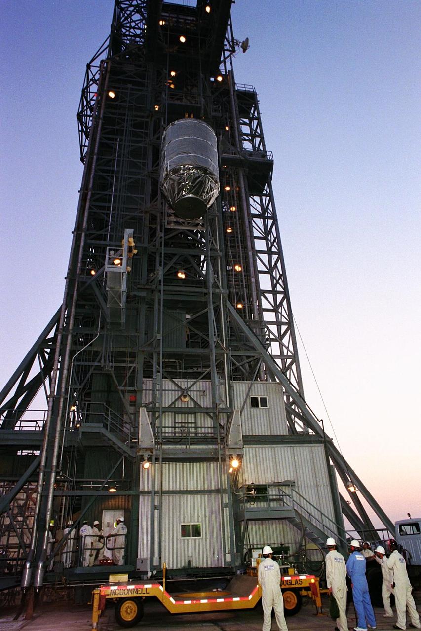 The Advanced Composition Explorer (ACE) spacecraft is placed atop its launch vehicle at Launch Complex 17A. Scheduled for launch on a Delta II rocket from Cape Canaveral Air Station on Aug. 24, ACE will study low-energy particles of solar origin and high-energy galactic particles. The collecting power of instruments aboard ACE is 10 to 1,000 times greater than anything previously flown to collect similar data by NASA