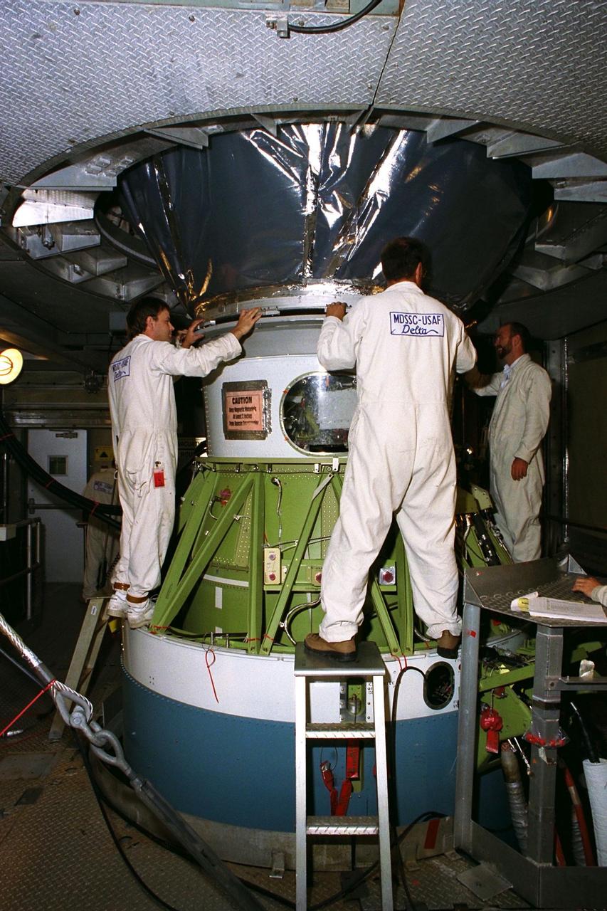 The Advanced Composition Explorer (ACE) spacecraft is placed atop its launch vehicle at Launch Complex 17A. Scheduled for launch on a Delta II rocket from Cape Canaveral Air Station on Aug. 24, ACE will study low-energy particles of solar origin and high-energy galactic particles. The collecting power of instruments aboard ACE is 10 to 1,000 times greater than anything previously flown to collect similar data by NASA