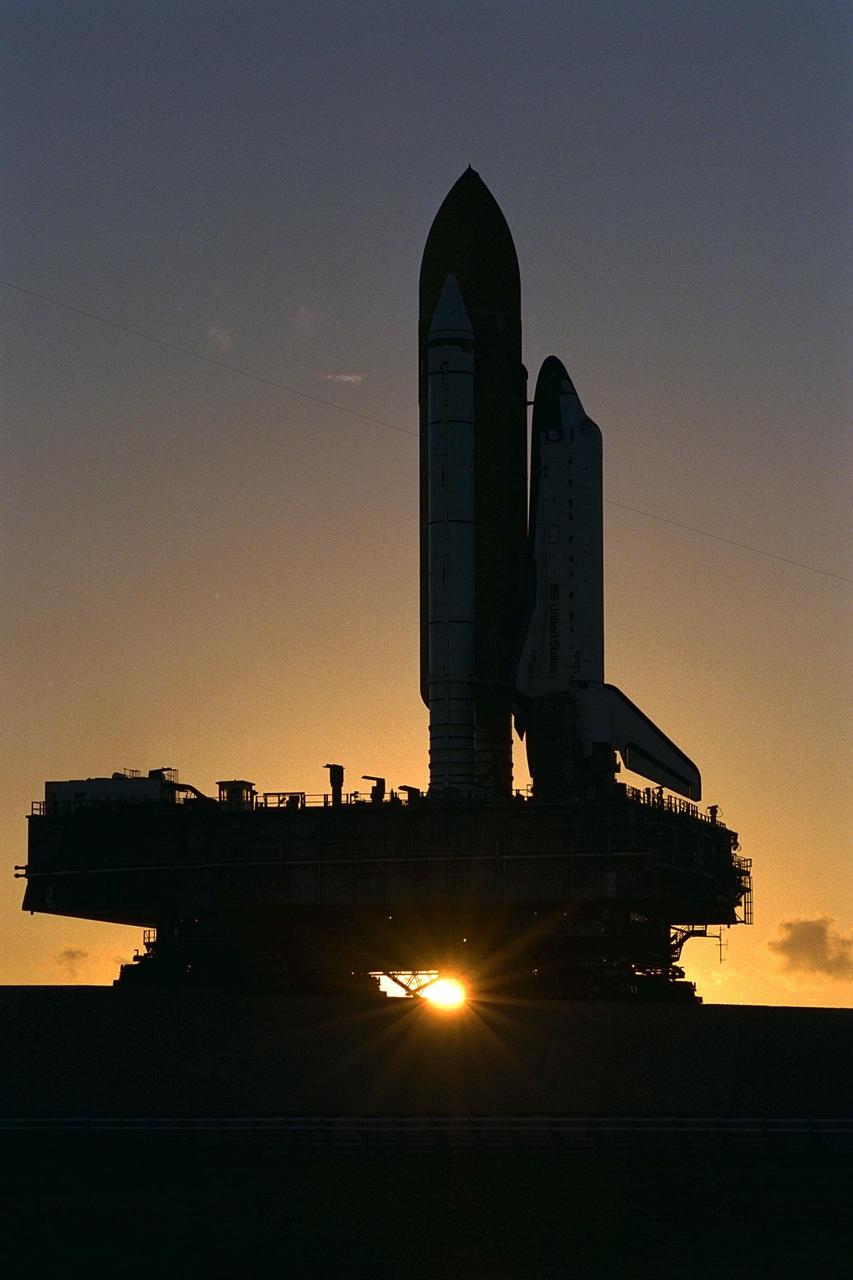 KENNEDY SPACE CENTER, Fla. -- Atop the crawler/transporter, the Space Shuttle orbiter Atlantis rolls out to Launch Complex 39A in preparation for mission STS-86, which is targeted for a September launch. STS-86 will be the seventh of nine planned dockings of the Space Shuttle orbiter with the Russian Space Station Mir