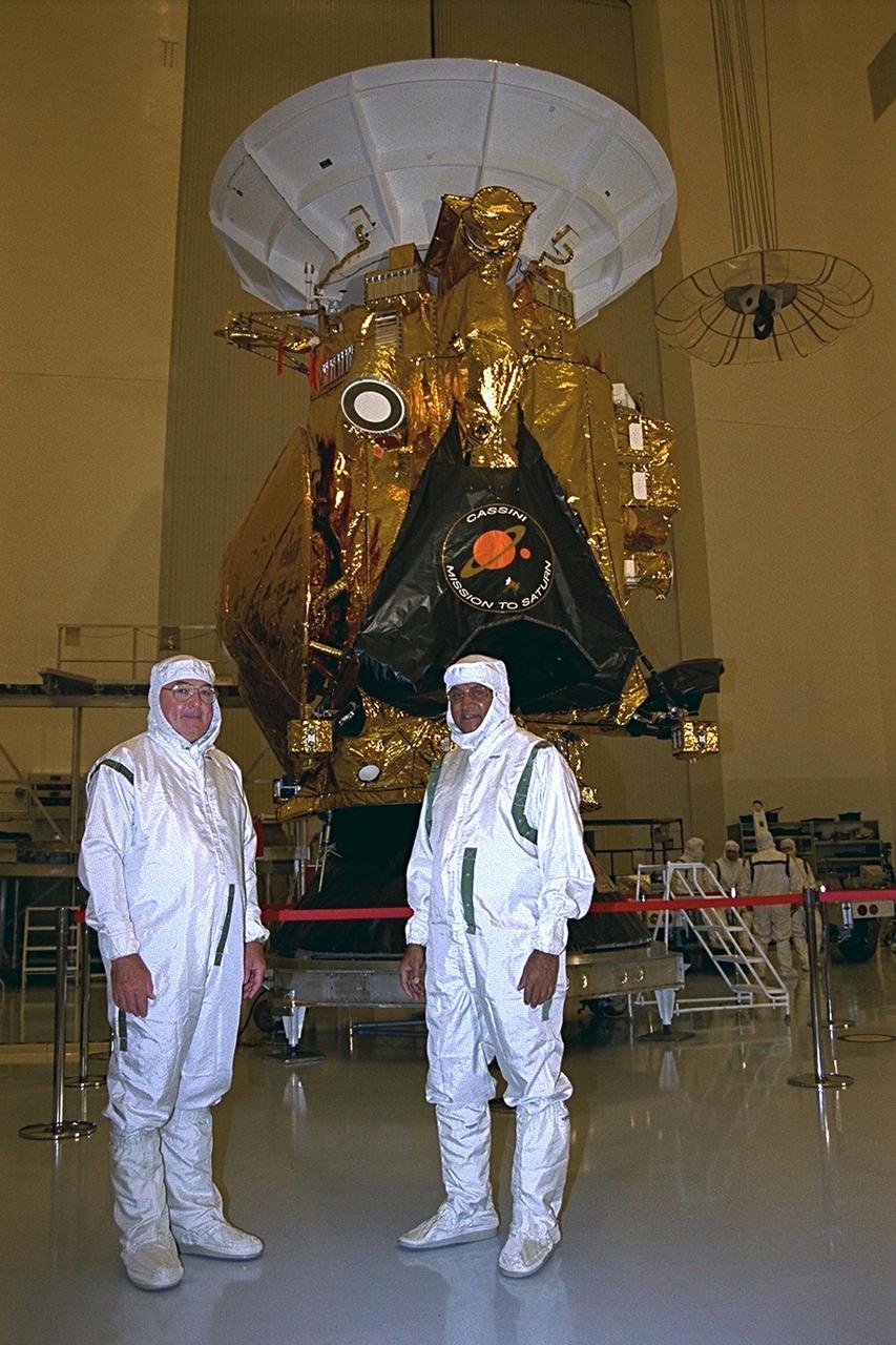 Richard Spehalski, program manager of the Cassini mission, and Hamid Hassan, the European Space Agency Huygens project manager, stand in front of the Cassini spacecraft in the Payload Hazardous Servicing Facility (PHSF). The Cassini spacecraft is scheduled to launch on an Air Force Titan IV/Centaur launch vehicle on Oct. 6, 1997. It is destined to arrive at Saturn in July 2004, to study Saturn, its rings, moons and magnetic environment for a four-year period. The Cassini project is managed for NASA by the Jet Propulsion Laboratory in Pasadena, Calif