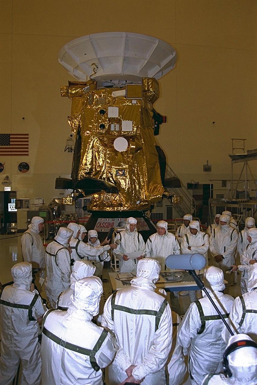 Scientists from the Cassini project at the Jet Propulsion Laboratory and the European Space Agency talk to photojournalists, news reporters, writers, television broadcasters, and cameramen in the Payload Hazardous Servicing Facility (PHSF) during the Cassini press showing. Cassini will launch on Oct. 6, 1997, on an Air Force Titan IV/Centaur launch vehicle and will arrive at Saturn in July 2004 to begin an international scientific mission to study the planet and its systems. Cassini is managed for NASA by the Jet Propulsion Laboratory at Pasadena, Calif