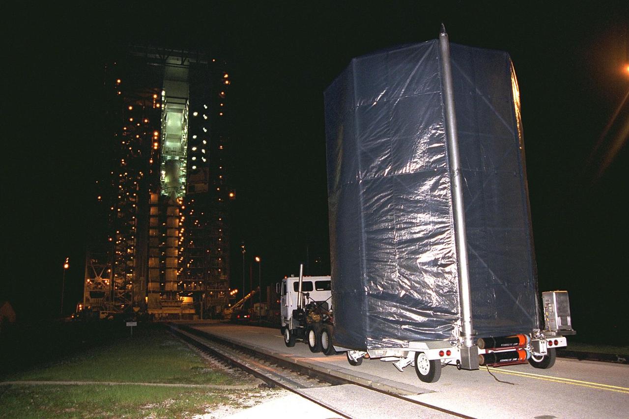 The Cassini spacecraft arrives at Complex 40, Cape Canaveral Air Station (CCAS), where it will be lifted to the top of its Titan IV/Centaur launch vehicle. Cassini is an international mission conducted by the National Aeronautics and Space Administration (NASA), the European Space Agency (ESA), and the Italian Space Agency (ASI). The two-story-tall spacecraft, scheduled for launch on Oct. 6, is destined to arrive at Saturn in July 2004, where it will orbit and study Saturn, its rings, moons and magnetic environment in detail over a four-year period. The Cassini mission is managed for NASA's Office of Space Science by the Jet Propulsion Laboratory, a division of the California Institute of Technology