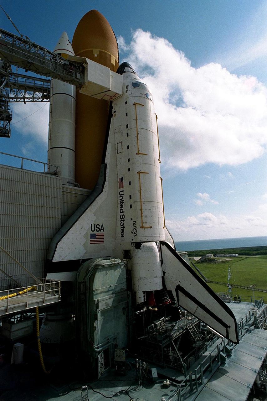 KENNEDY SPACE CENTER, Fla. -- With its rotating service structure (RSS) rotated back, the Space Shuttle Atlantis appears ready for flight at Launch Pad 39A. But there are still about three weeks of preparations until the planned launch of Mission STS-86 on Sept. 25. The RSS is rolled back to allow for the insertion of the major payload, the SPACEHAB Double Module, into the orbiter’s cargo bay. SPACEHAB will be used to transport items to and from the Russian Space Shuttle Mir on Mission STS-86, which will be the seventh docking of the Shuttle with the Mir. About three-and-a-half tons of science/logistical equipment and supplies will be exchanged between Atlantis and the Mir during the mission. STS-86 Mission Specialist David A. Wolf will transfer to the Russian space station, replacing NASA astronaut and Mir 24 crew member C. Michael Foale, who will return to Earth on Atlantis. Liftoff is targeted for Sept. 25